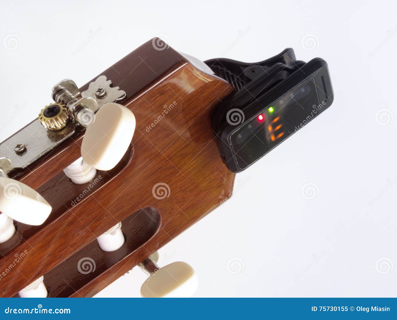 Headstock of the Guitar with Installed Clipon Tuner, that Shows Stock