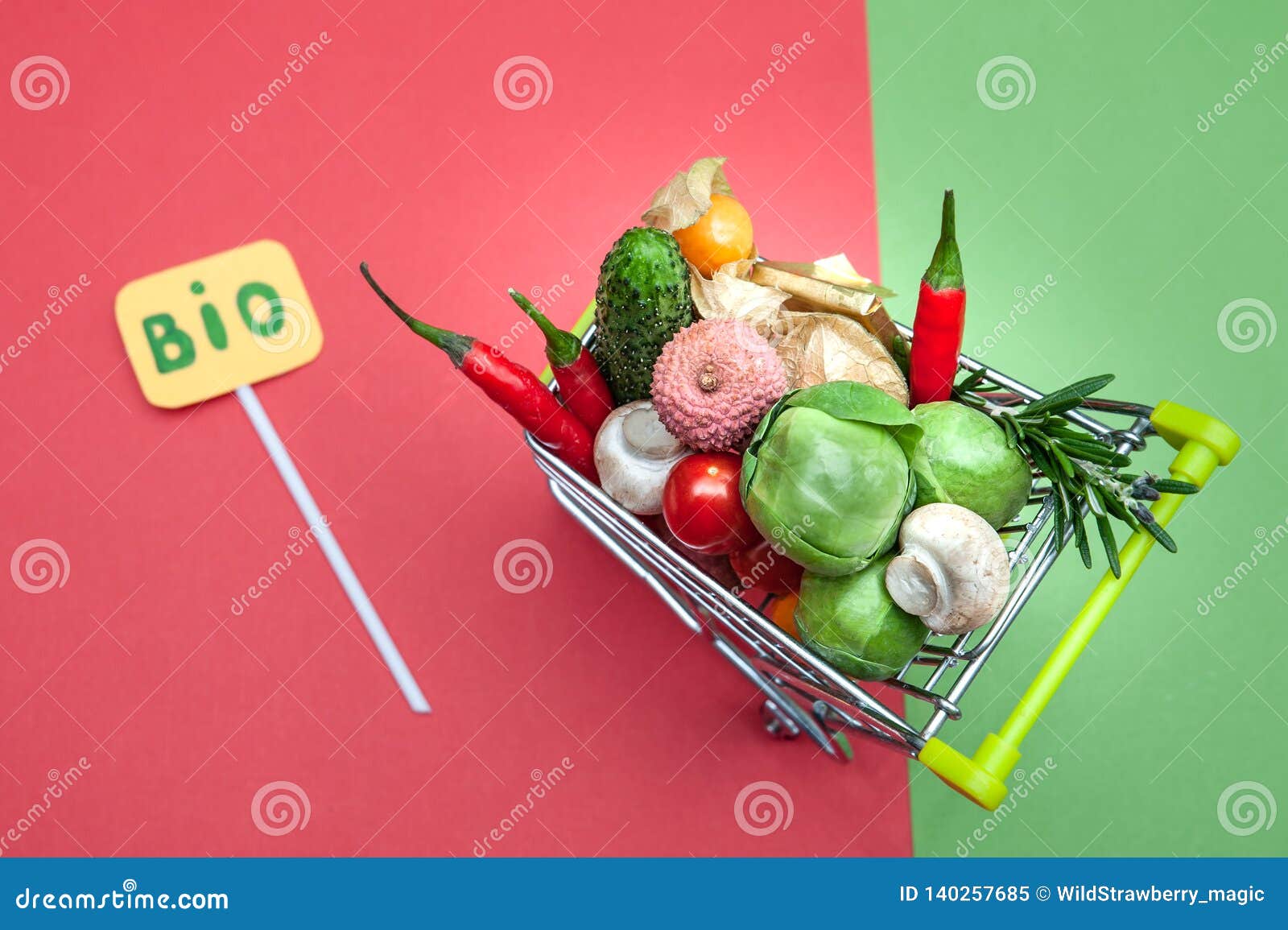 health bio organic food concept, shopping cart in supermarket full of fruits and vegetables,