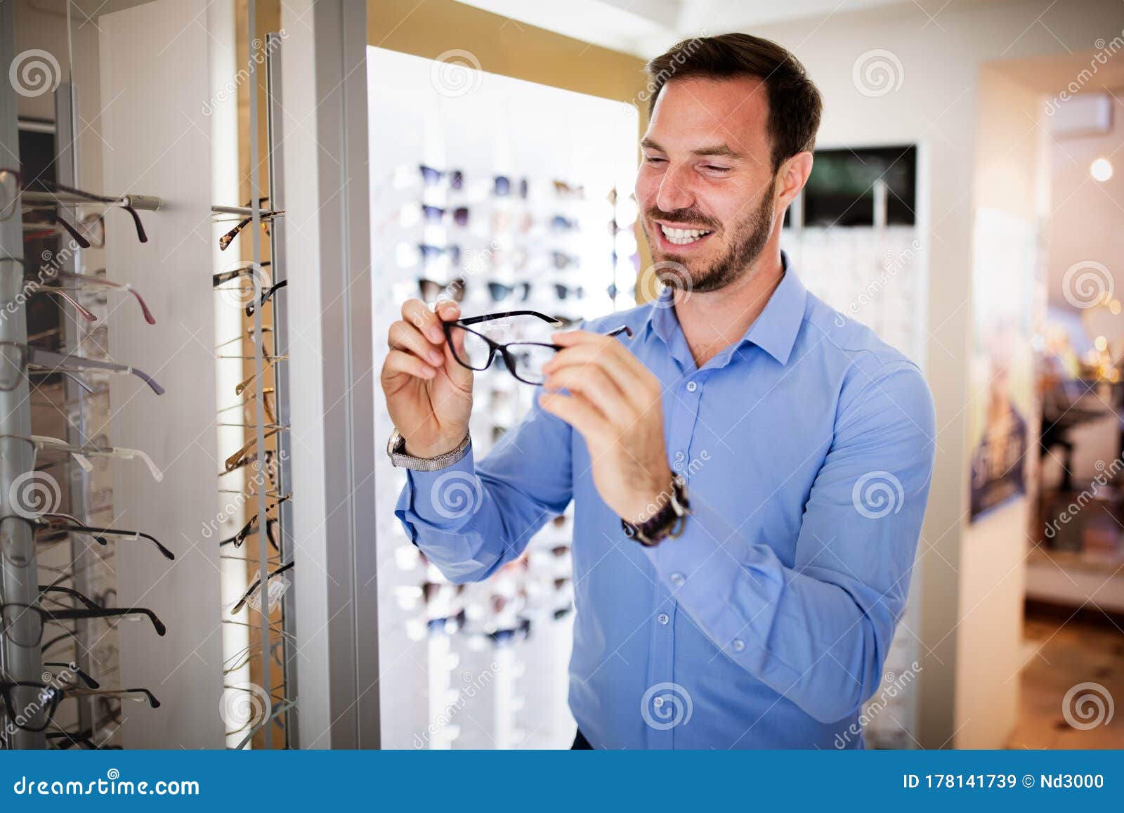 Health Care, Eyesight and Vision Concept - Happy Man Choosing Glasses ...