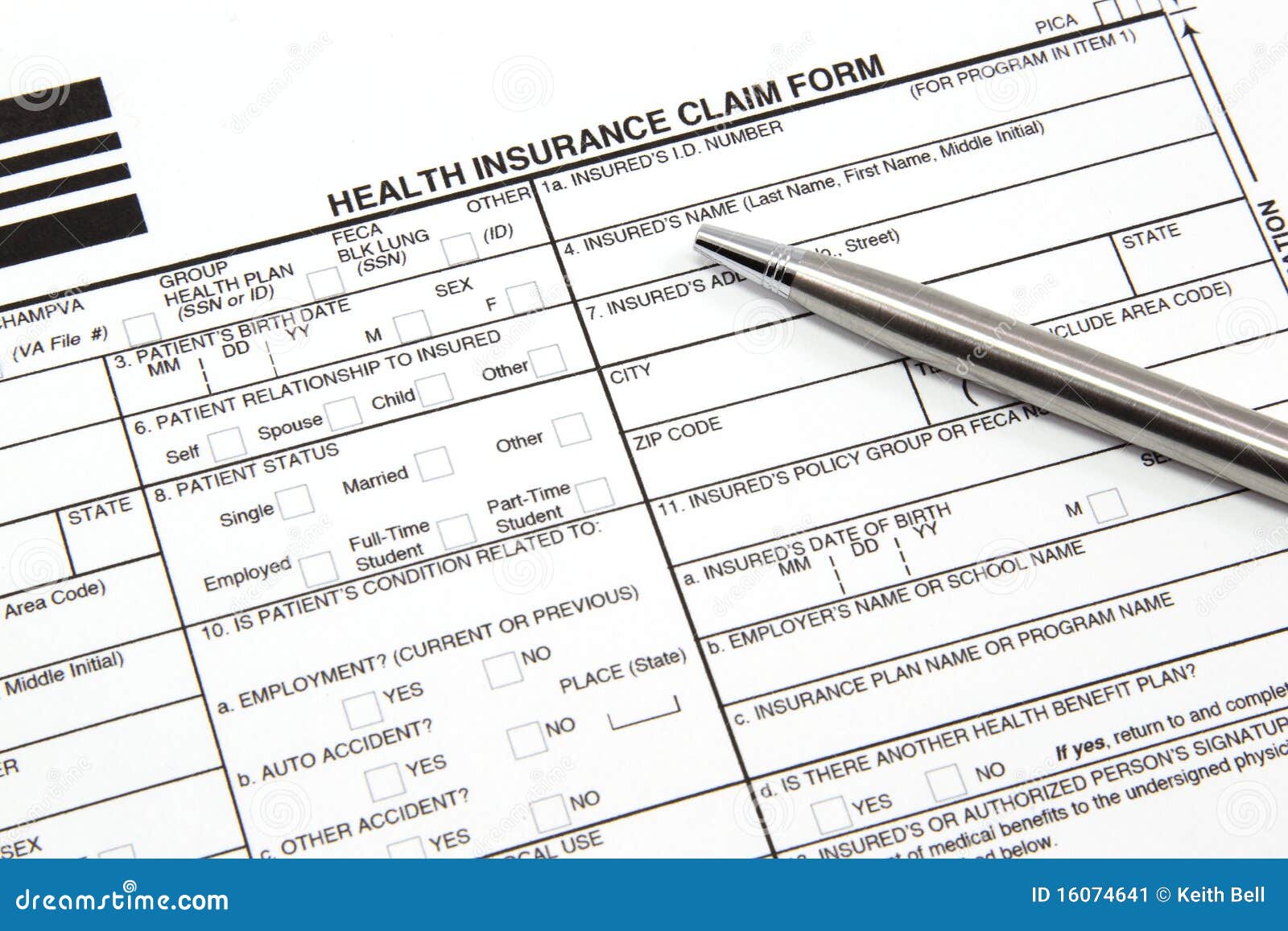 health insurance claim form with silver pen