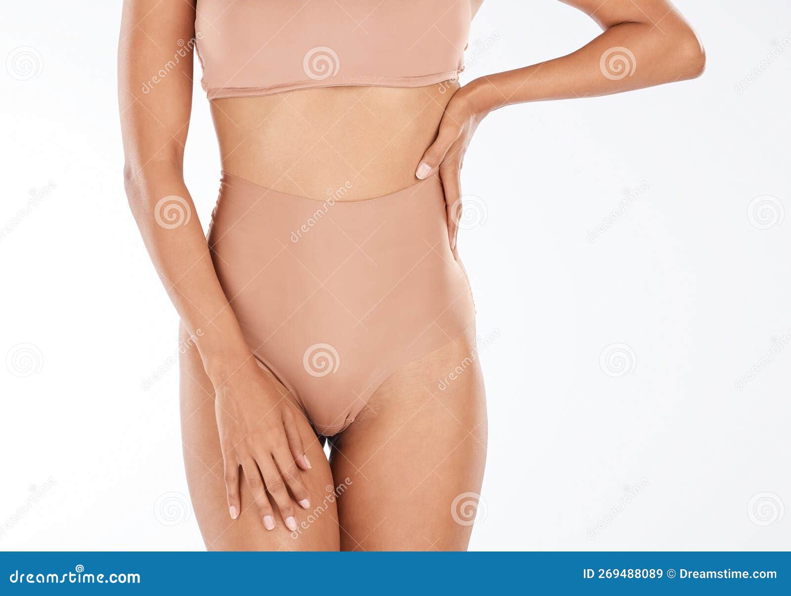 Health, slim and body of a woman in underwear isolated on a white  background in a studio. Wellness, beauty and stomach of a fitness girl with  a slimming shape, attradctive and in