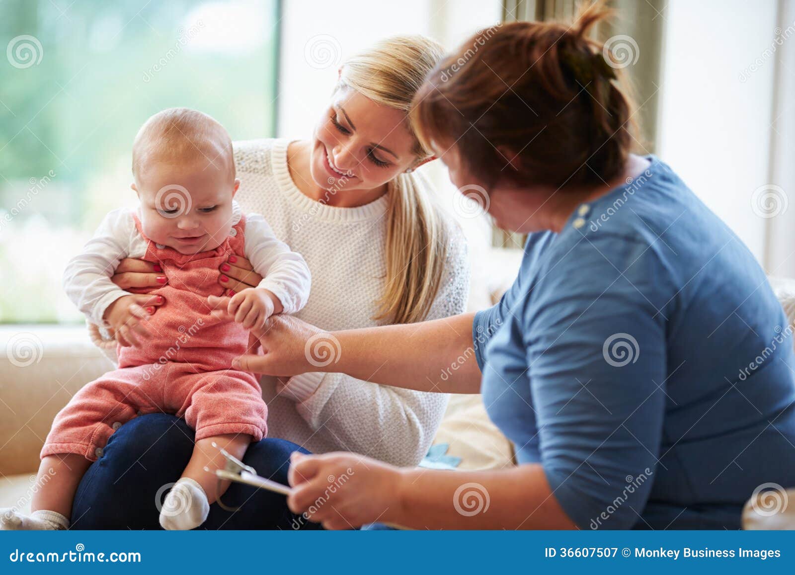 health visitor talking to mother with young baby
