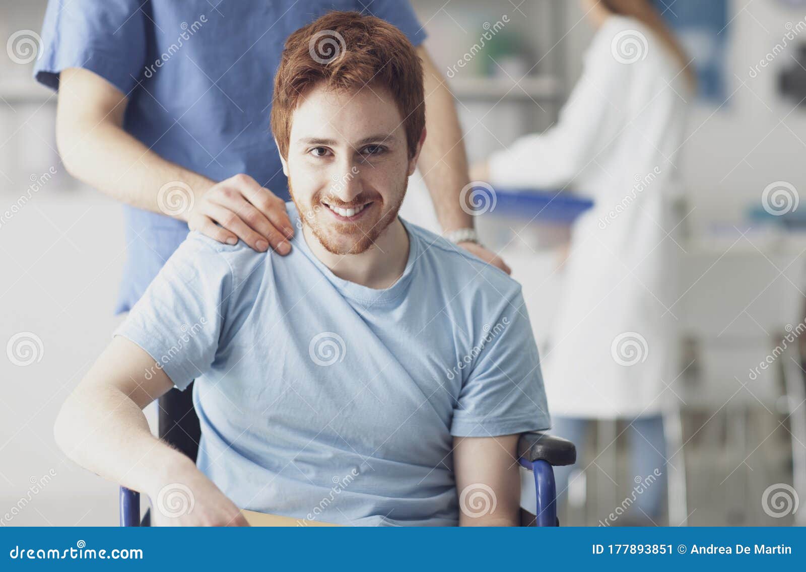 healthcare worker pushing a man in wheelchair