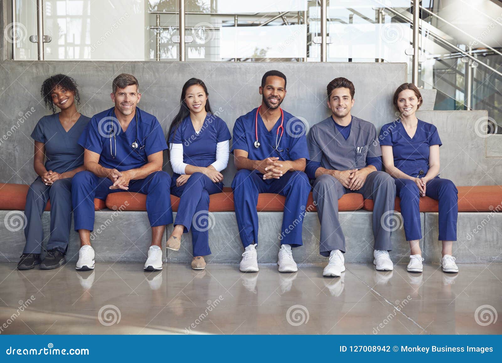 Healthcare Workers Sitting in a Modern Hospital, Low Angle Stock Photo