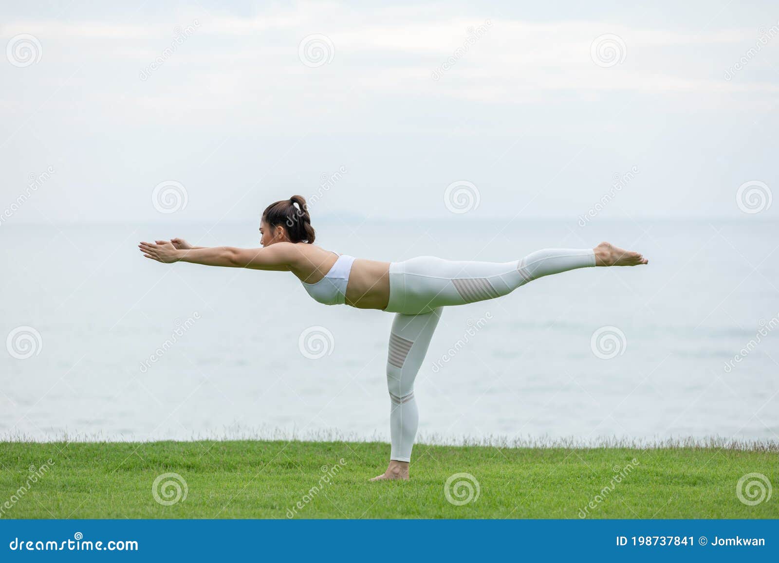 Healthy Asian Woman Practicing Yoga Balancing Stick Pose