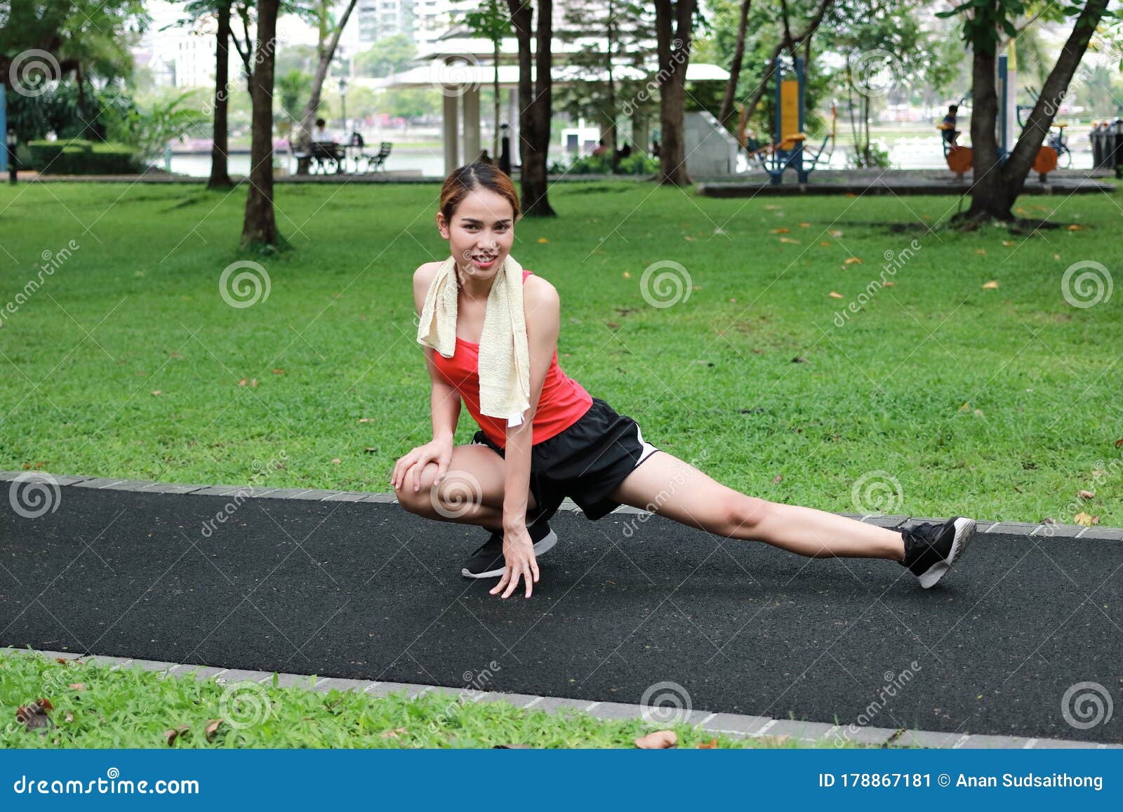 Healthy Asian Woman Stretching Her Legs Before Run In Park Fitness And 