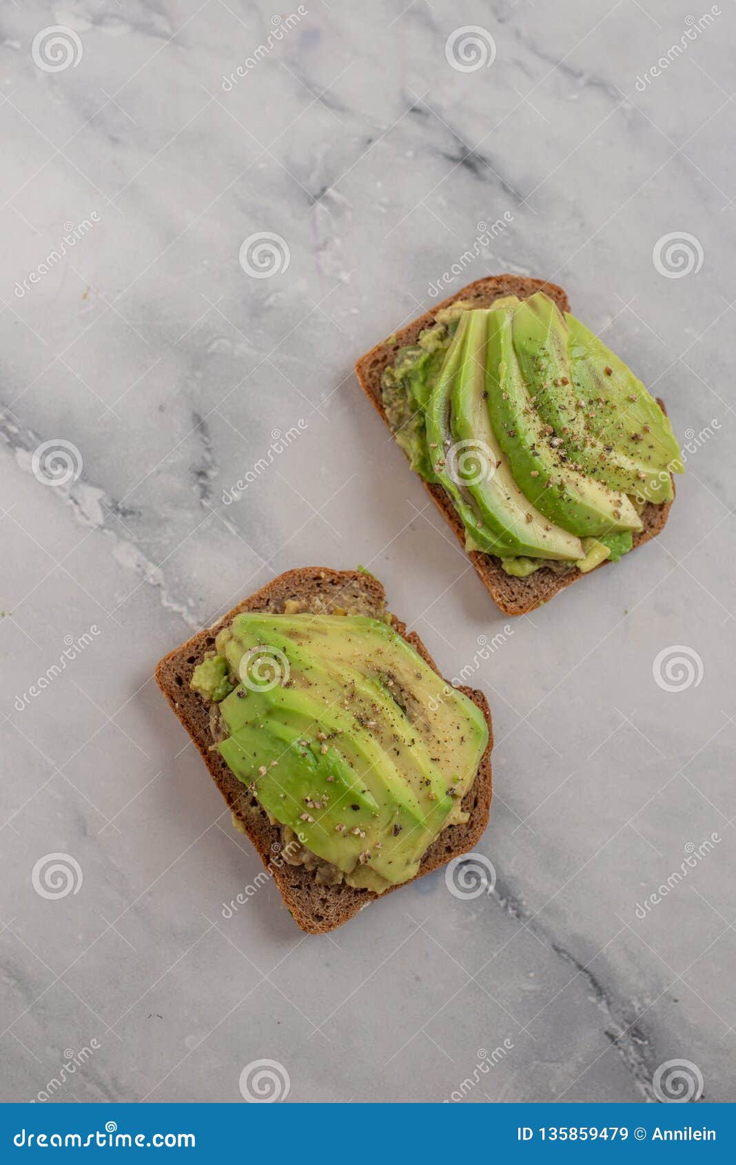 Healthy Avocado Toast. Mashed Avocado on Whole Grain Rye Bread Stock