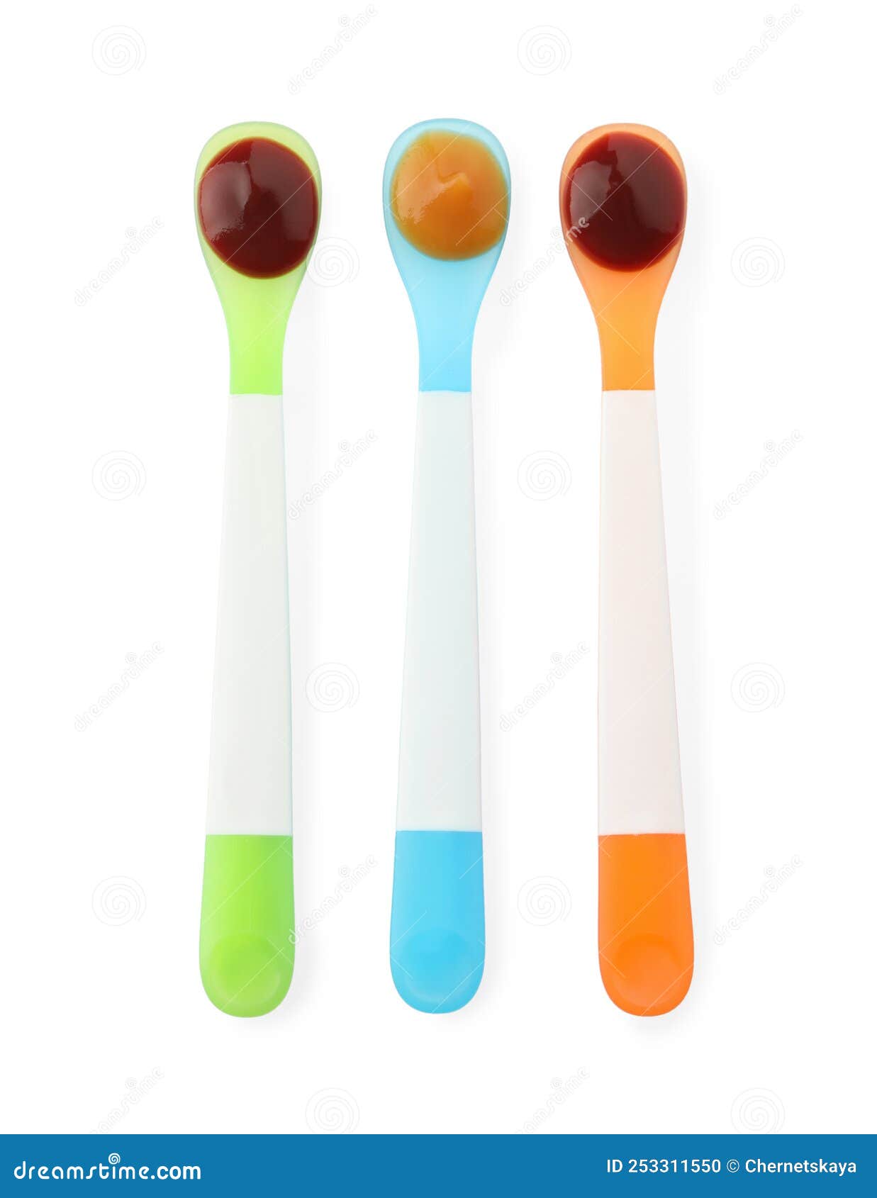 Healthy Baby Food In Spoons On White Background Top View Stock Photo healthy-baby-food-in-spoons-on-white-background-top-view-stock-photo