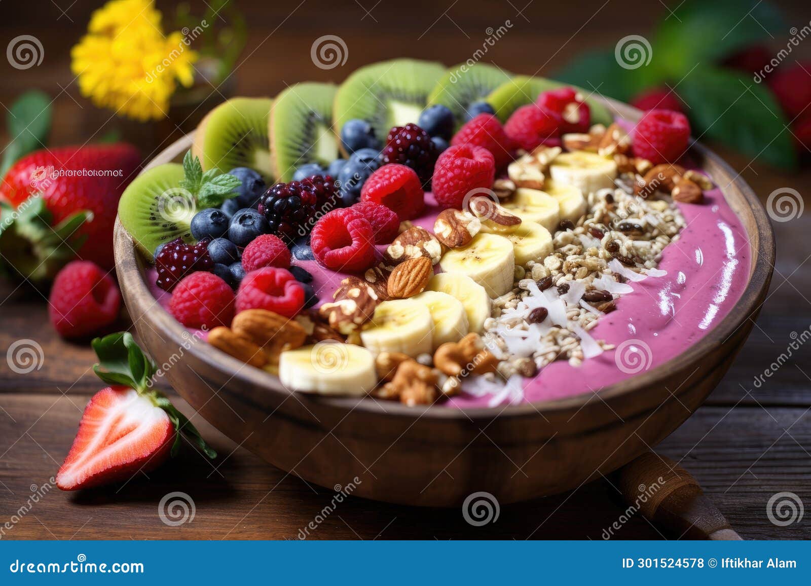 Healthy Breakfast Bowl with Yogurt, Granola, Berries and Nuts on Wooden