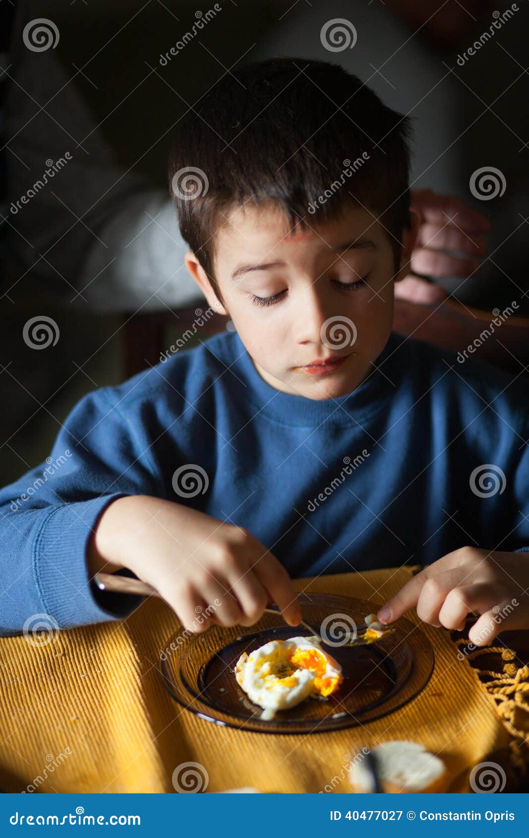 Eating egg for breakfast stock image. Image of food, looking 40477027