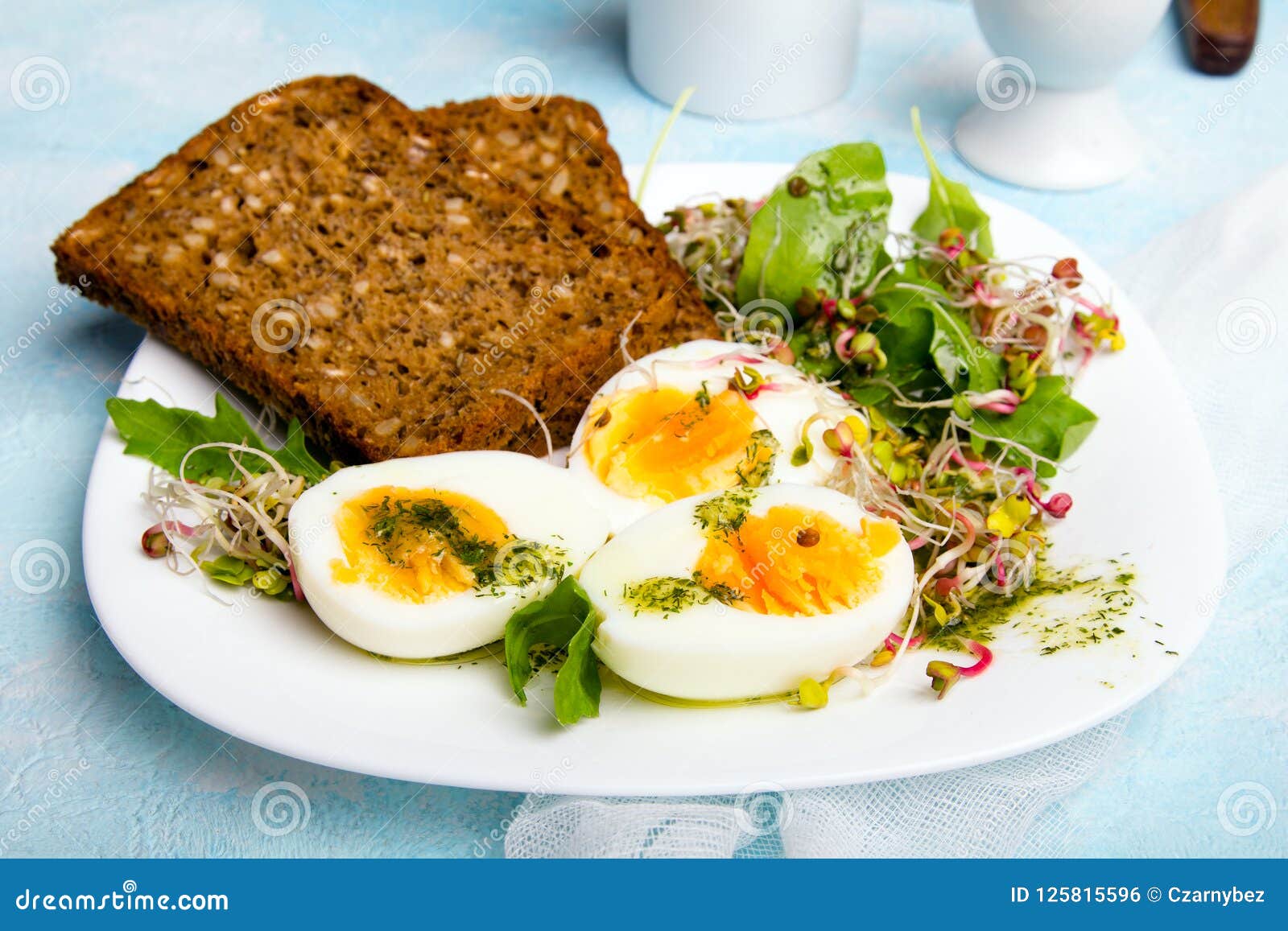 Healthy Breakfast: Hard Boiled Eggs, Fresh Radish Sprouts, Arugula and