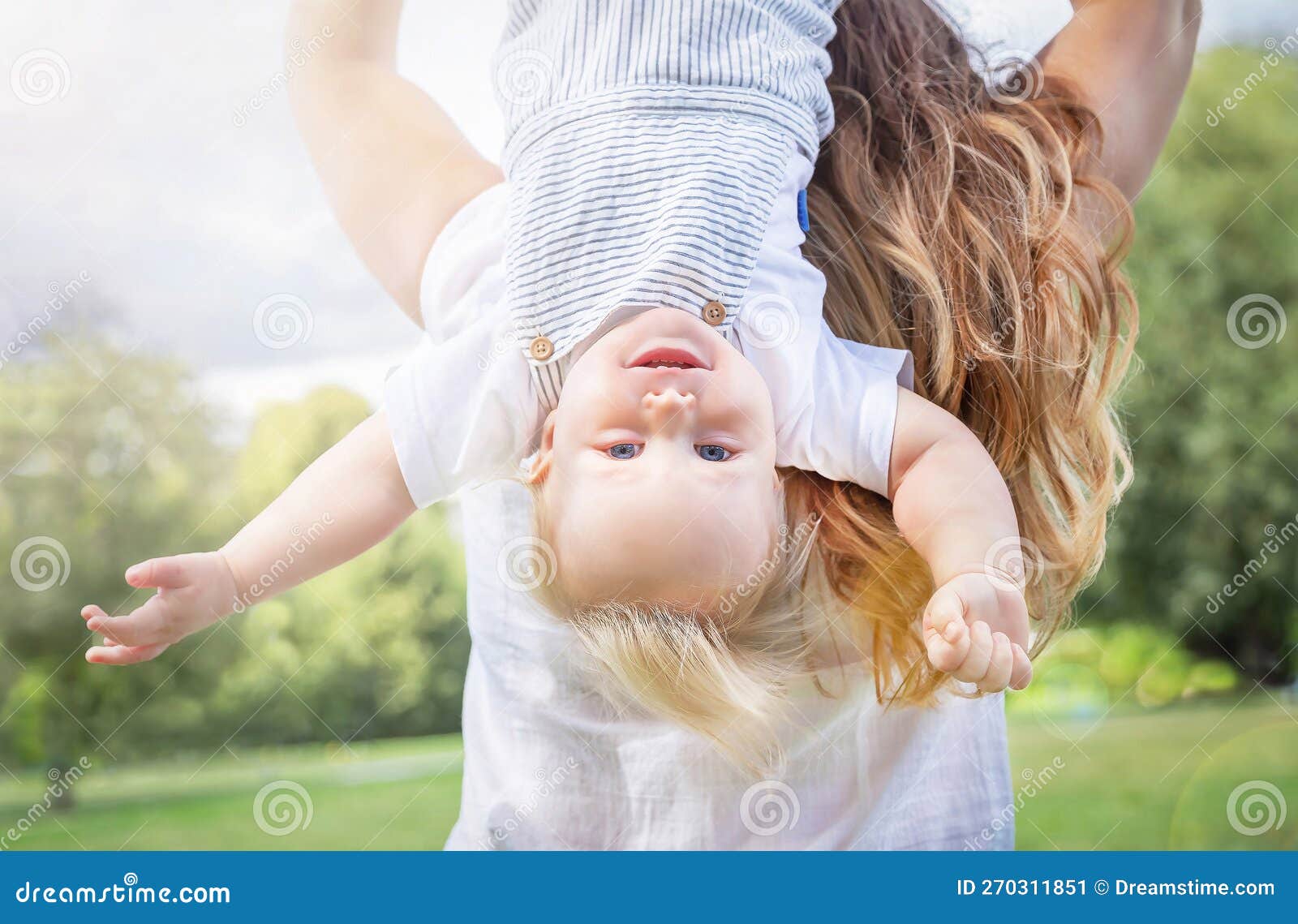 healthy child (kid) having fun with mother in the sunny summer day. caucasians happy baby (boy)..
