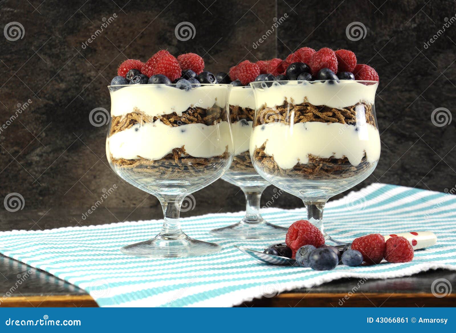 healthy diet high dietary fiber breakfast with bran cereal, yoghurt and berries sundaes