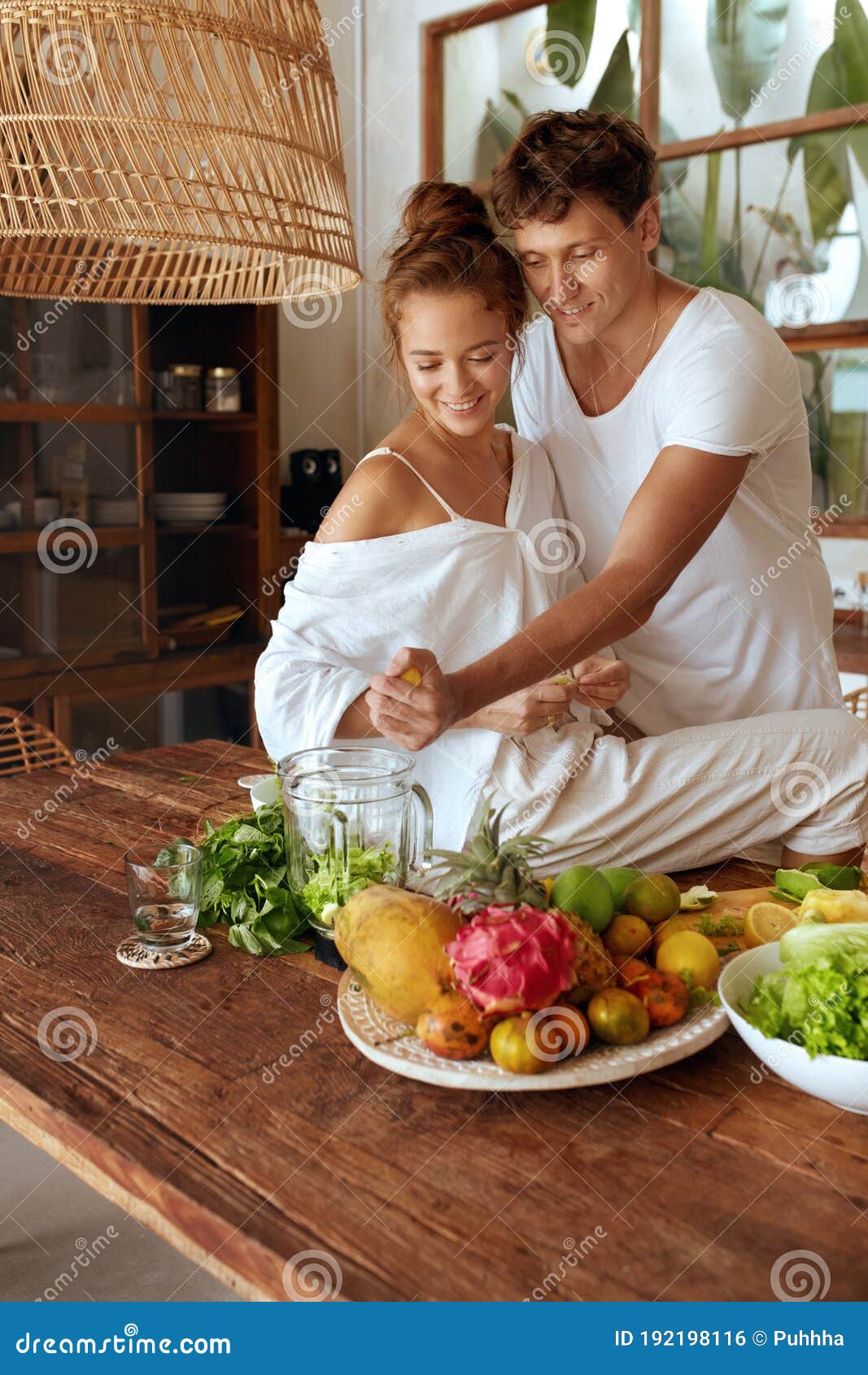 Healthy Diet. Romantic Couple Cooking Vegetarian Food at Kitchen in