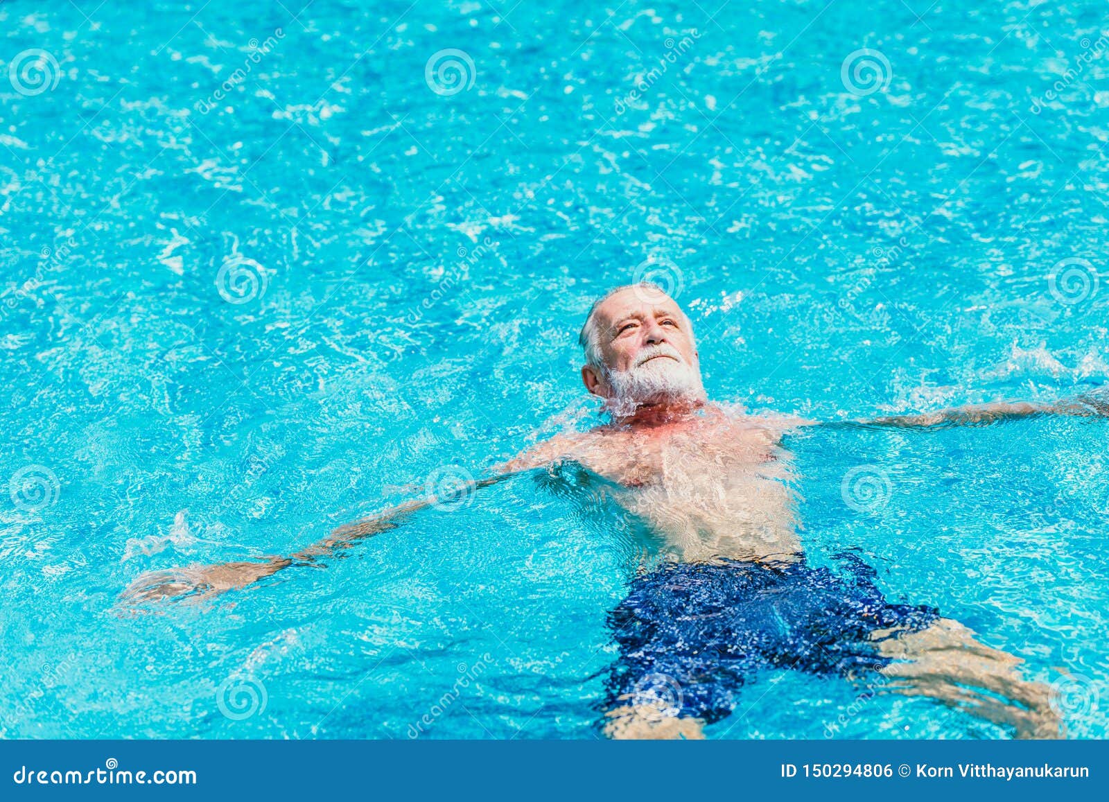 healthy elder enjoy relax swimming in the swimming pool alone vacation holiday
