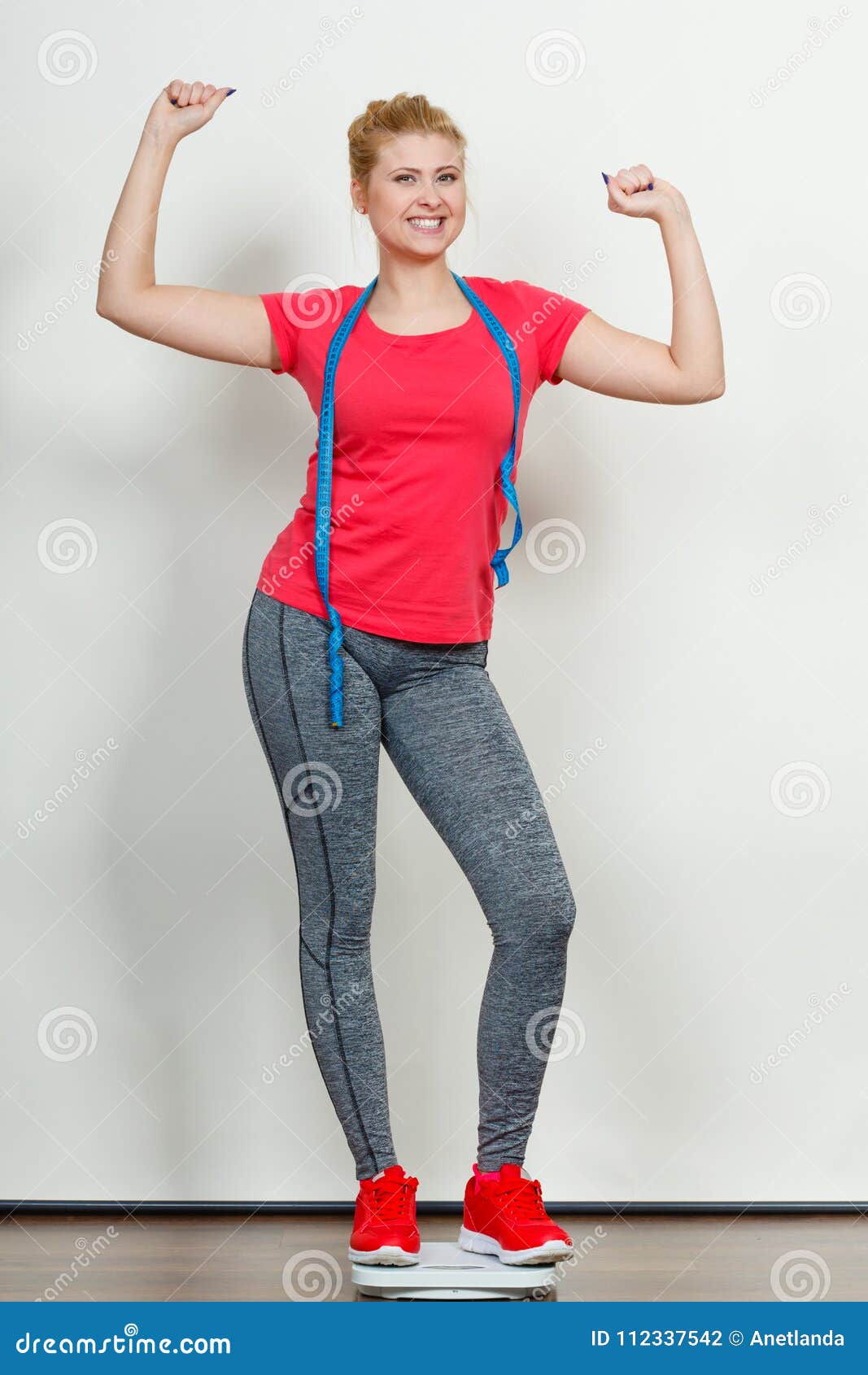 Woman Wearing Sportswear Standing on Weight Machine Stock Photo - Image ...