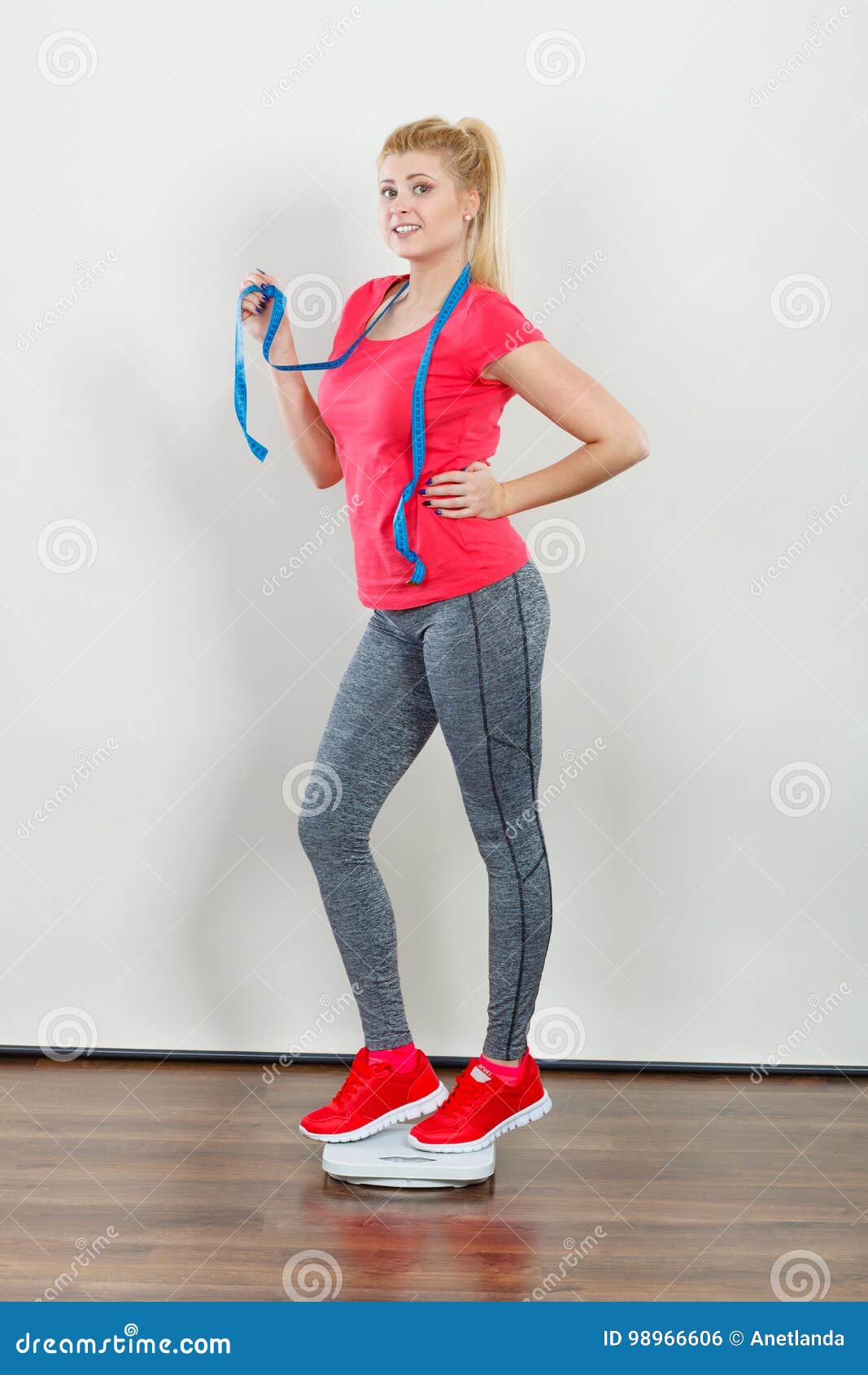 Woman Wearing Sportswear Standing on Weight Machine Stock Photo - Image ...