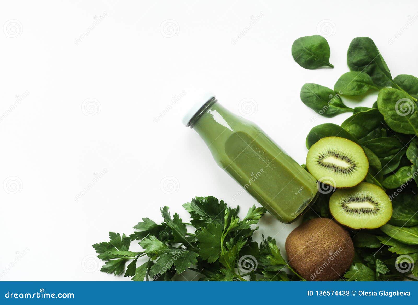 healthy green smoothie or juice and ingredients on white - superfoods, detox, diet, health, vegetarian food concept. copy space