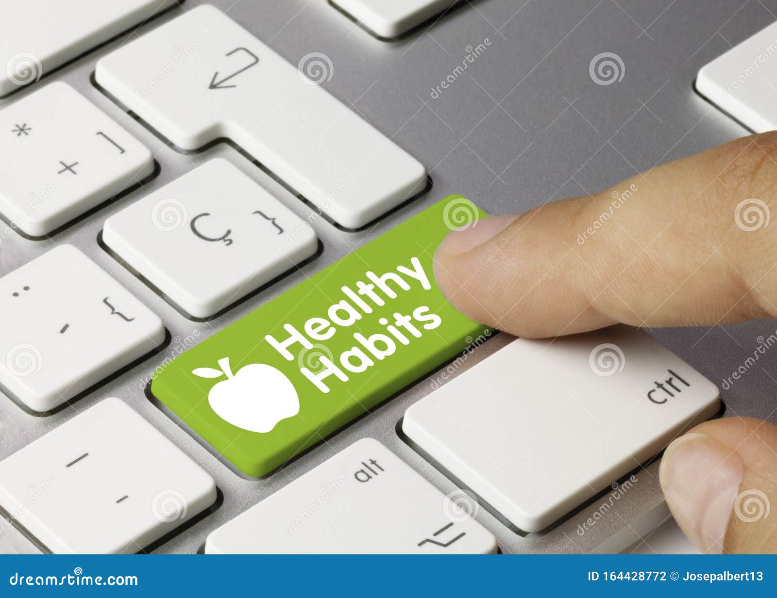 healthy habits - inscription on green keyboard key