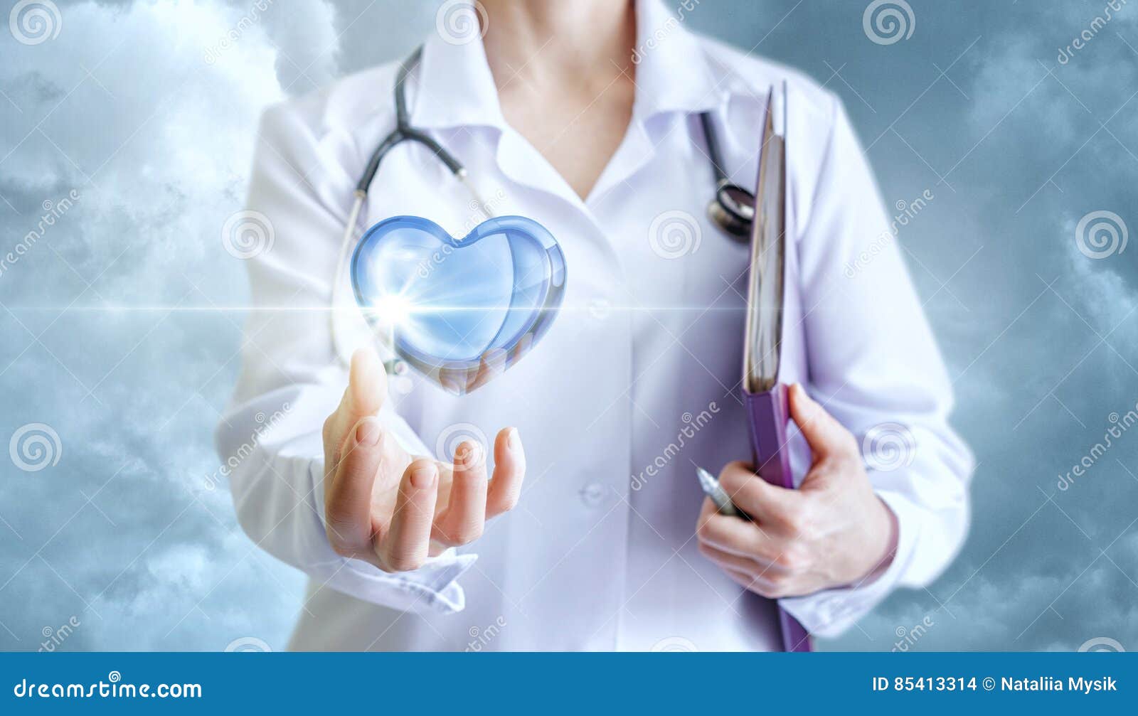 healthy heart in the hand of the cardiologist.