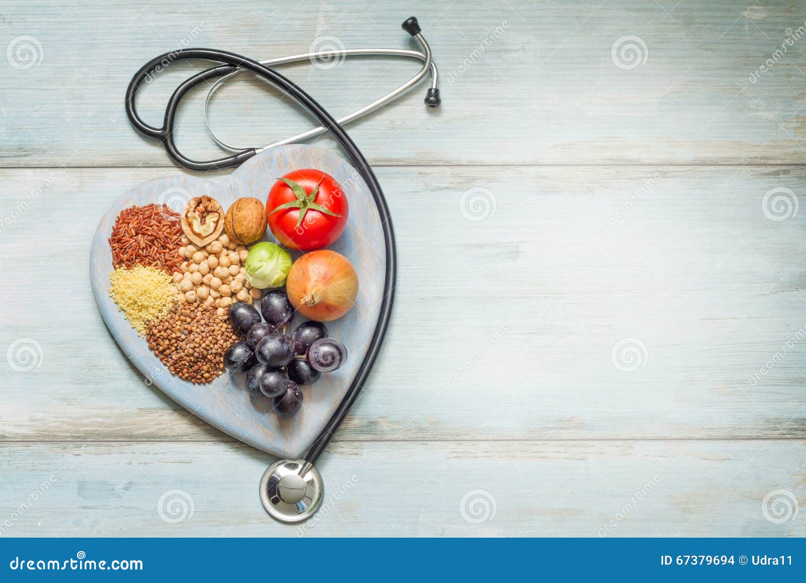 healthy lifestyle and healthcare concept with food, heart and stethoscope