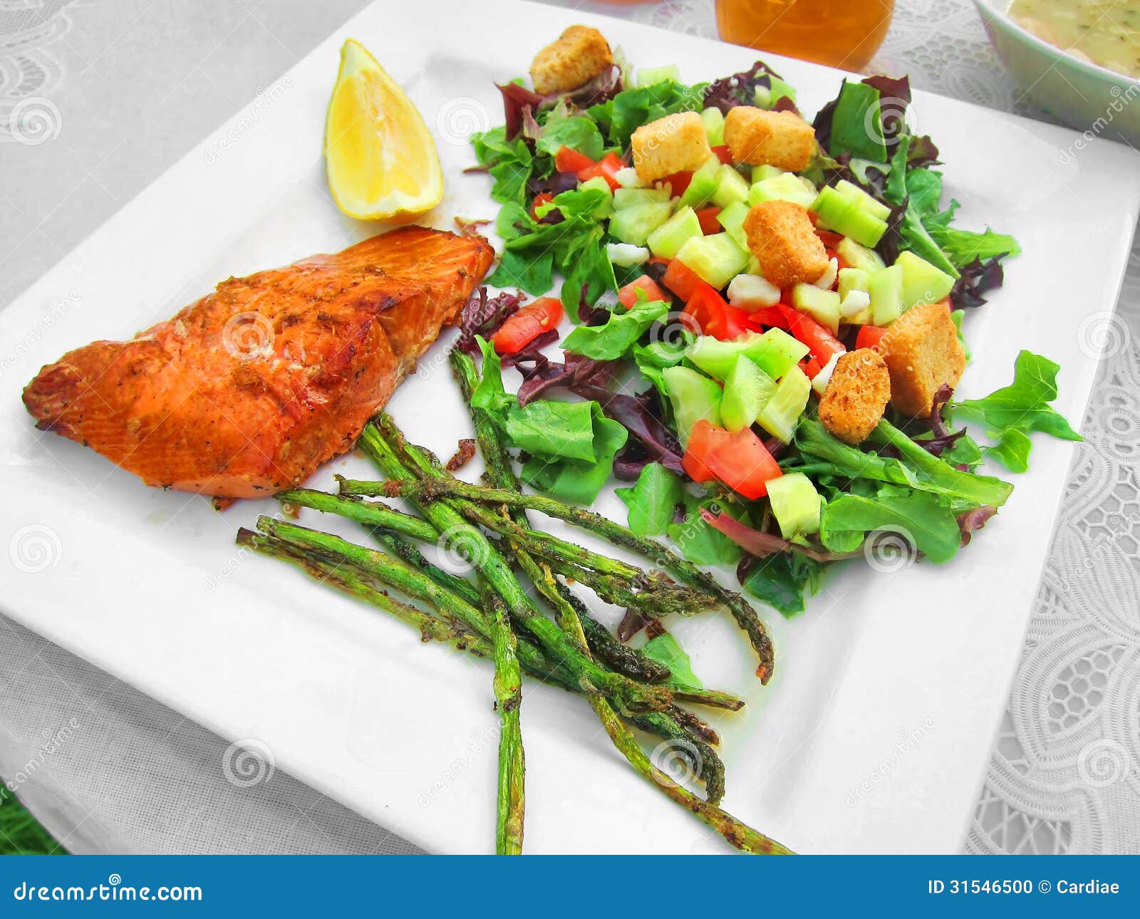 Healthy meal dinner lunch on white plate with fish salmon trout and 