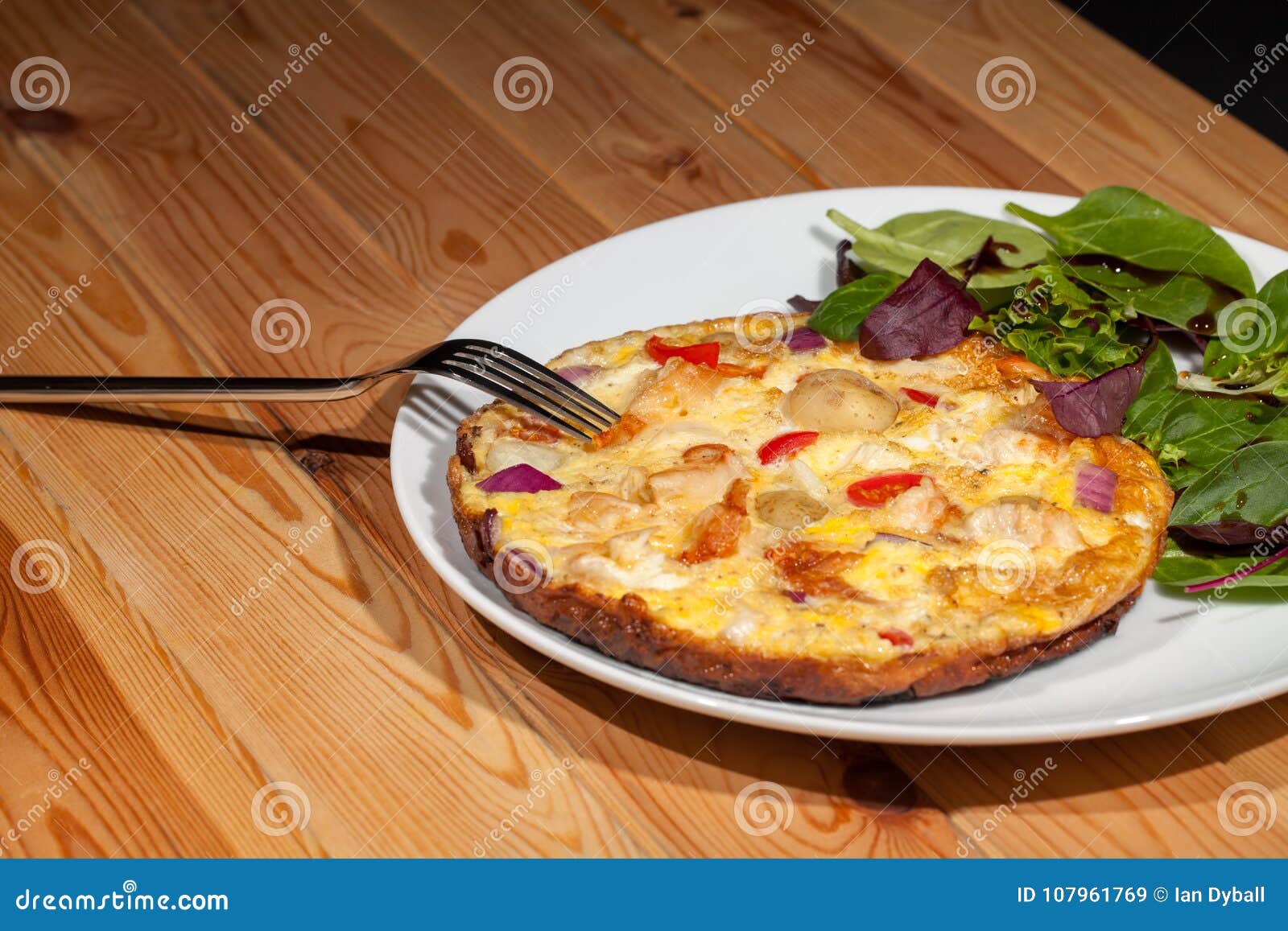 Healthy Nutritional Slimmer Meal. Spanish Omelette and Baby Leaf Stock ...