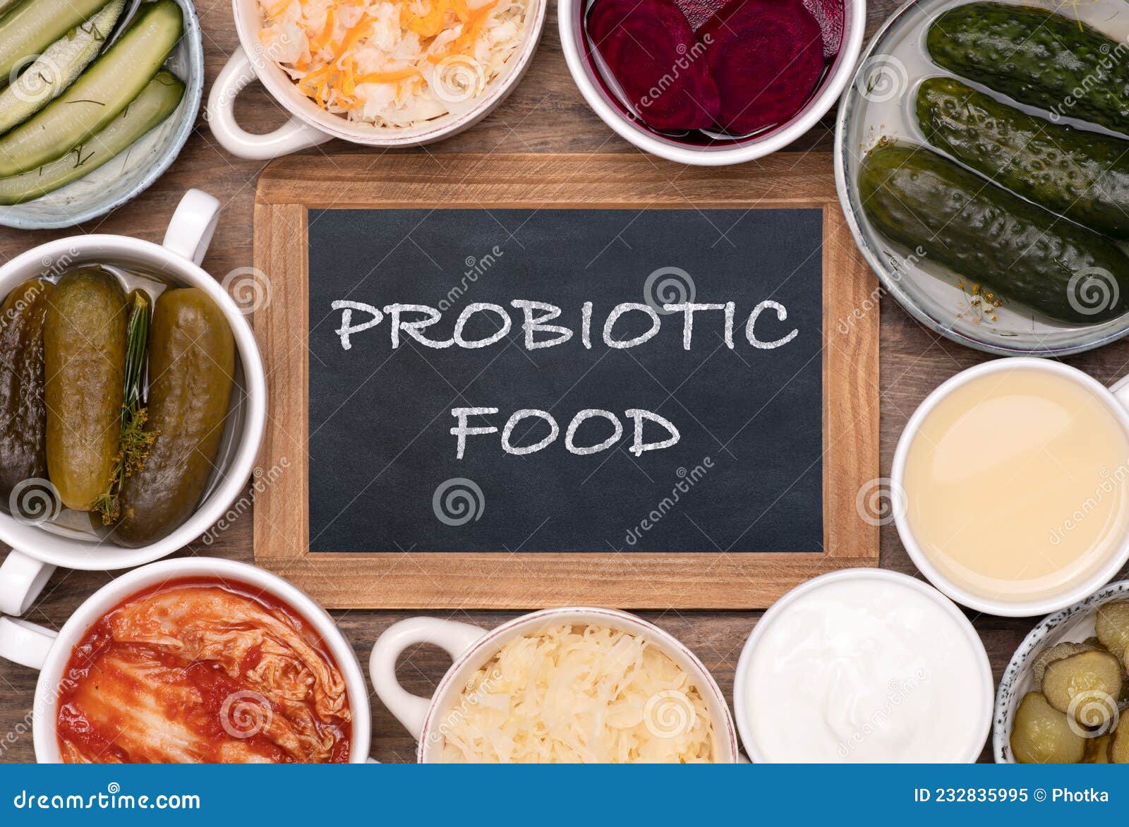 healthy probiotic fermented foods in cups and bowls