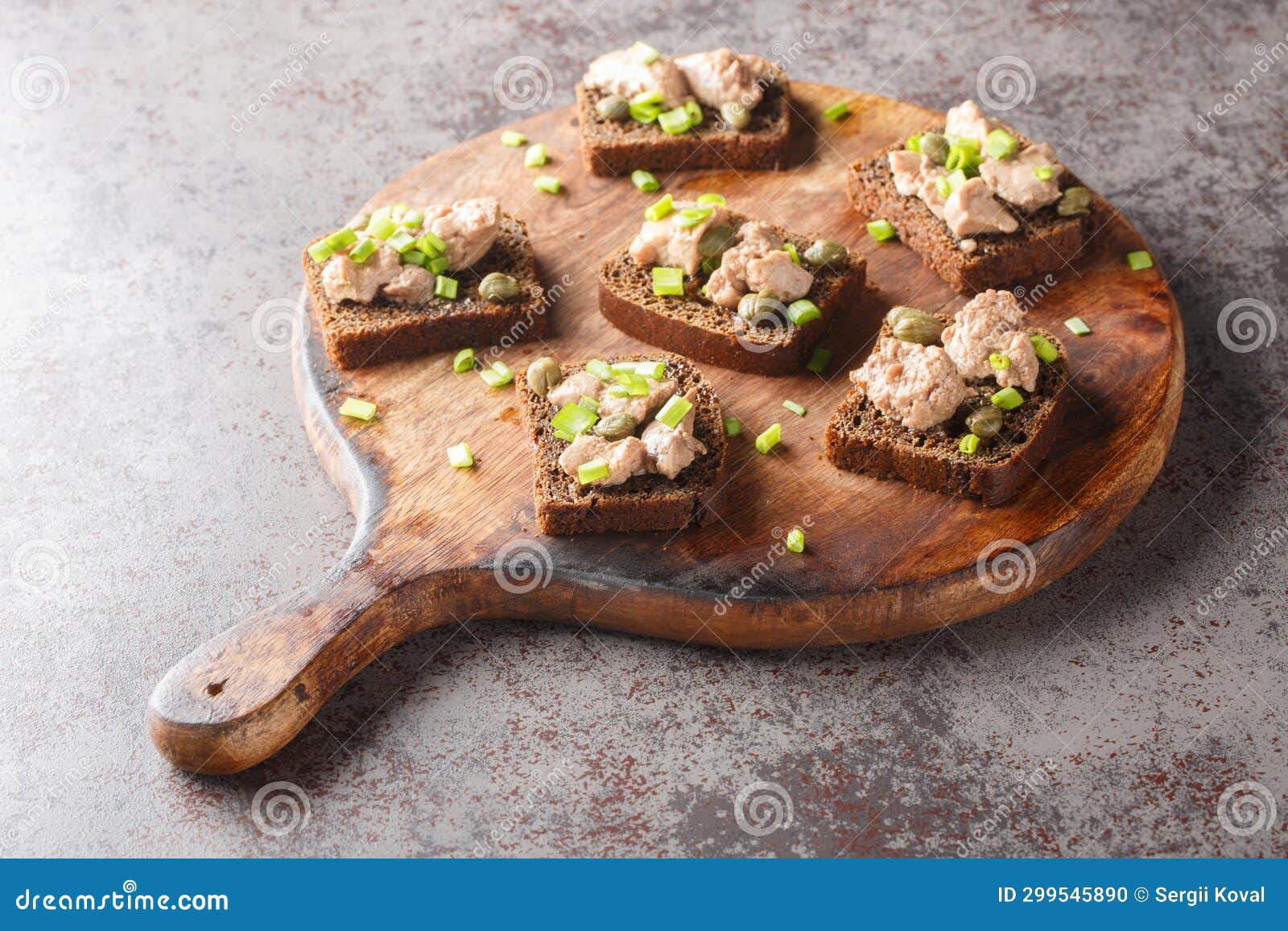 Healthy Rye Bread with Canned Cod Liver, Capers and Green Onions Close