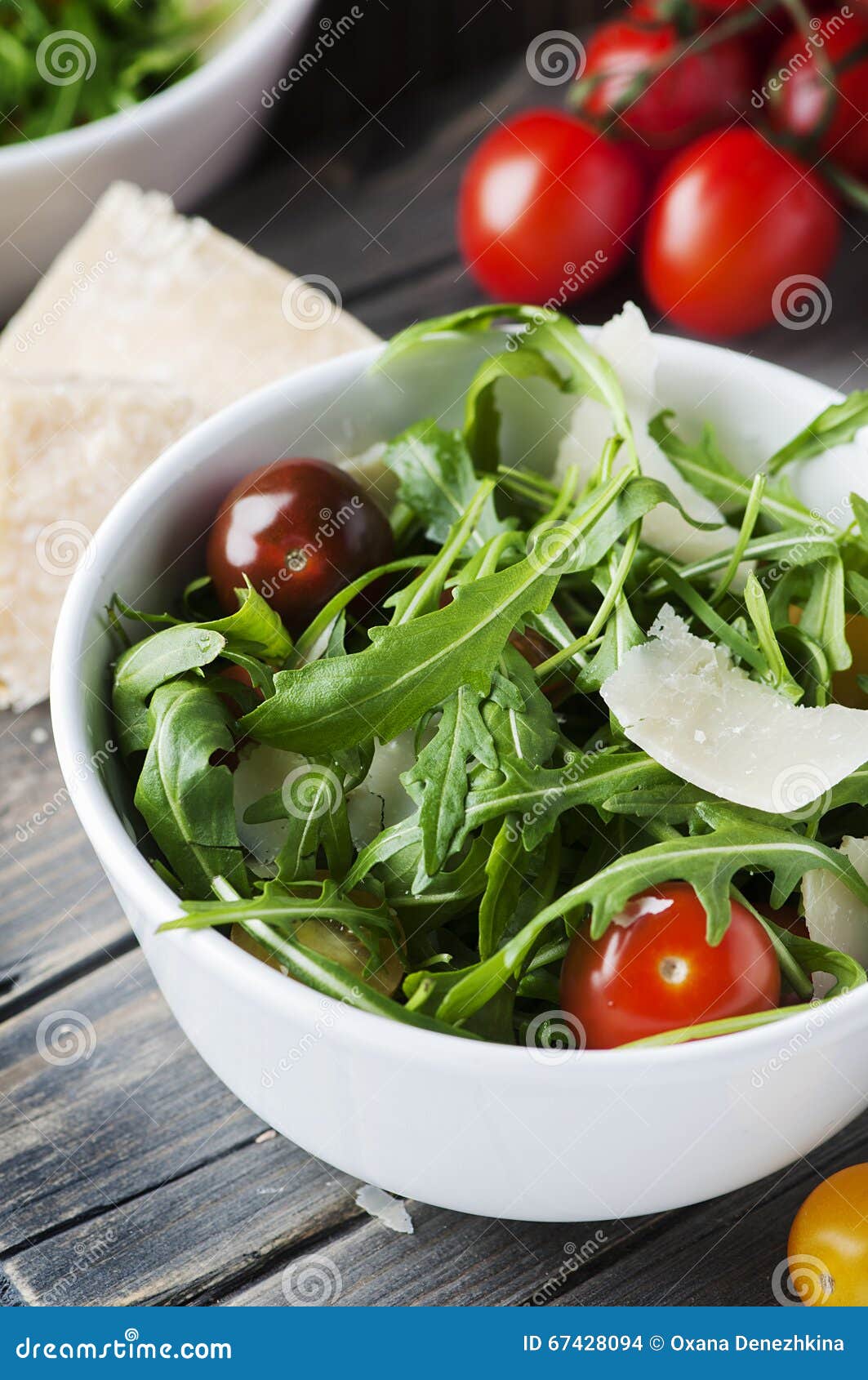 Healthy Salad with Rocket, Tomato and Parmesan Cheese Stock Photo