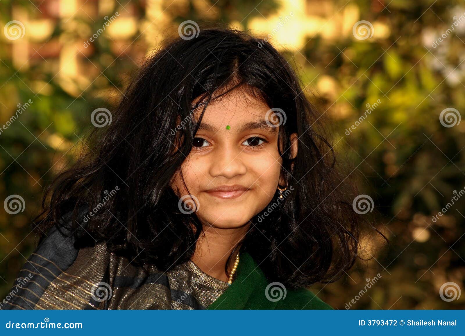 Free Photos - A Young, Smiling Girl With Curly Hair, Sitting On The Grass  And Wearing Traditional Indian Jewelry. She Appears To Be In A Happy And  Playful Mood, Possibly Enjoying An