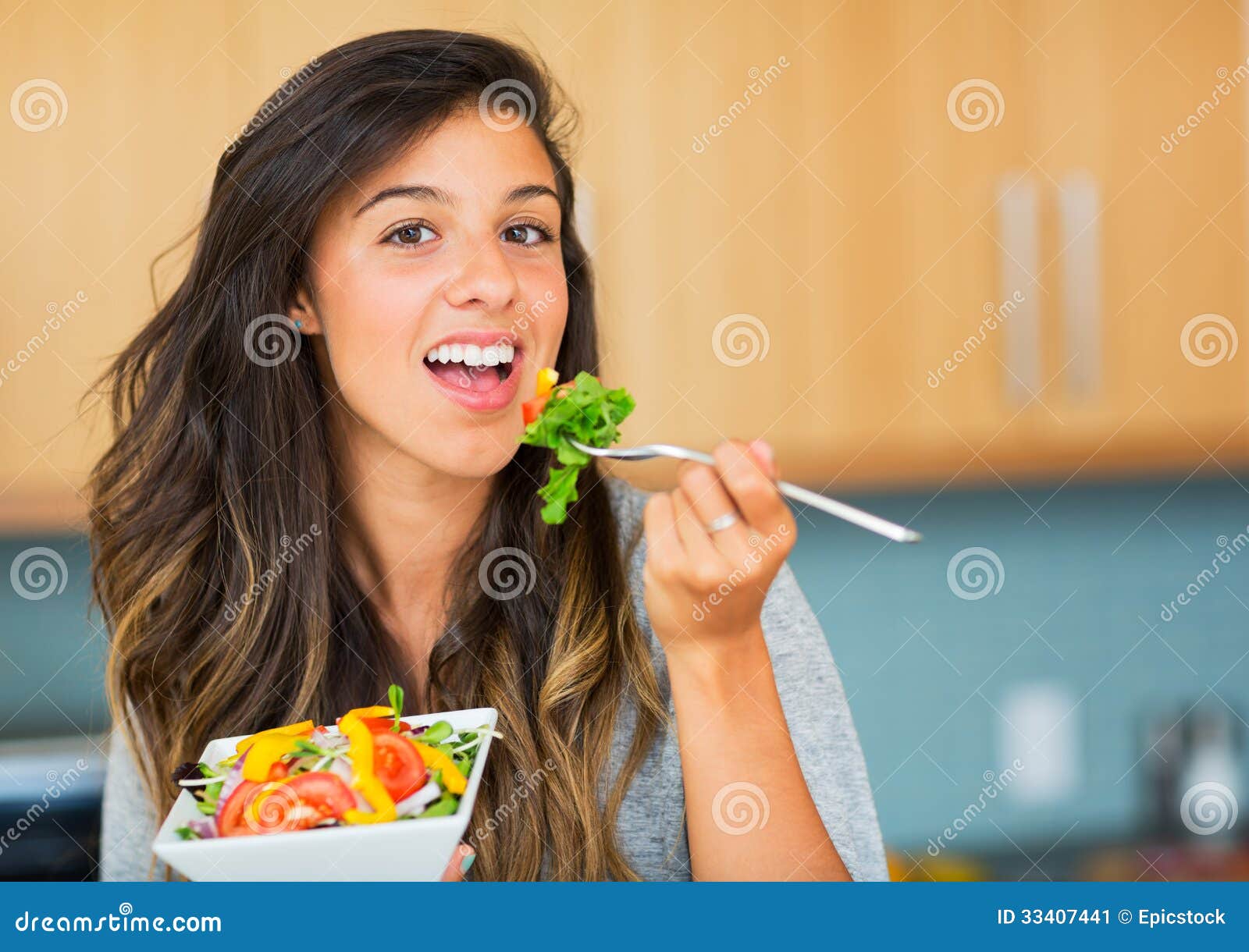 healthy woman eating salad