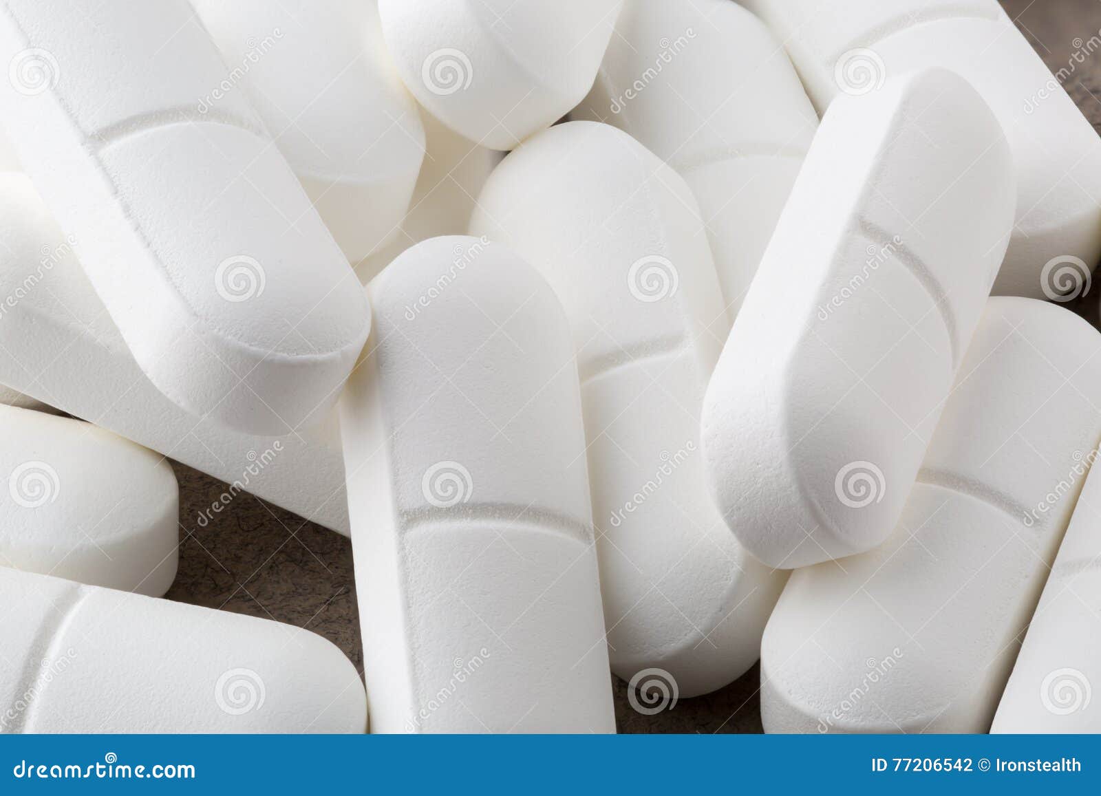 heap of antibiotic white pills. closeup
