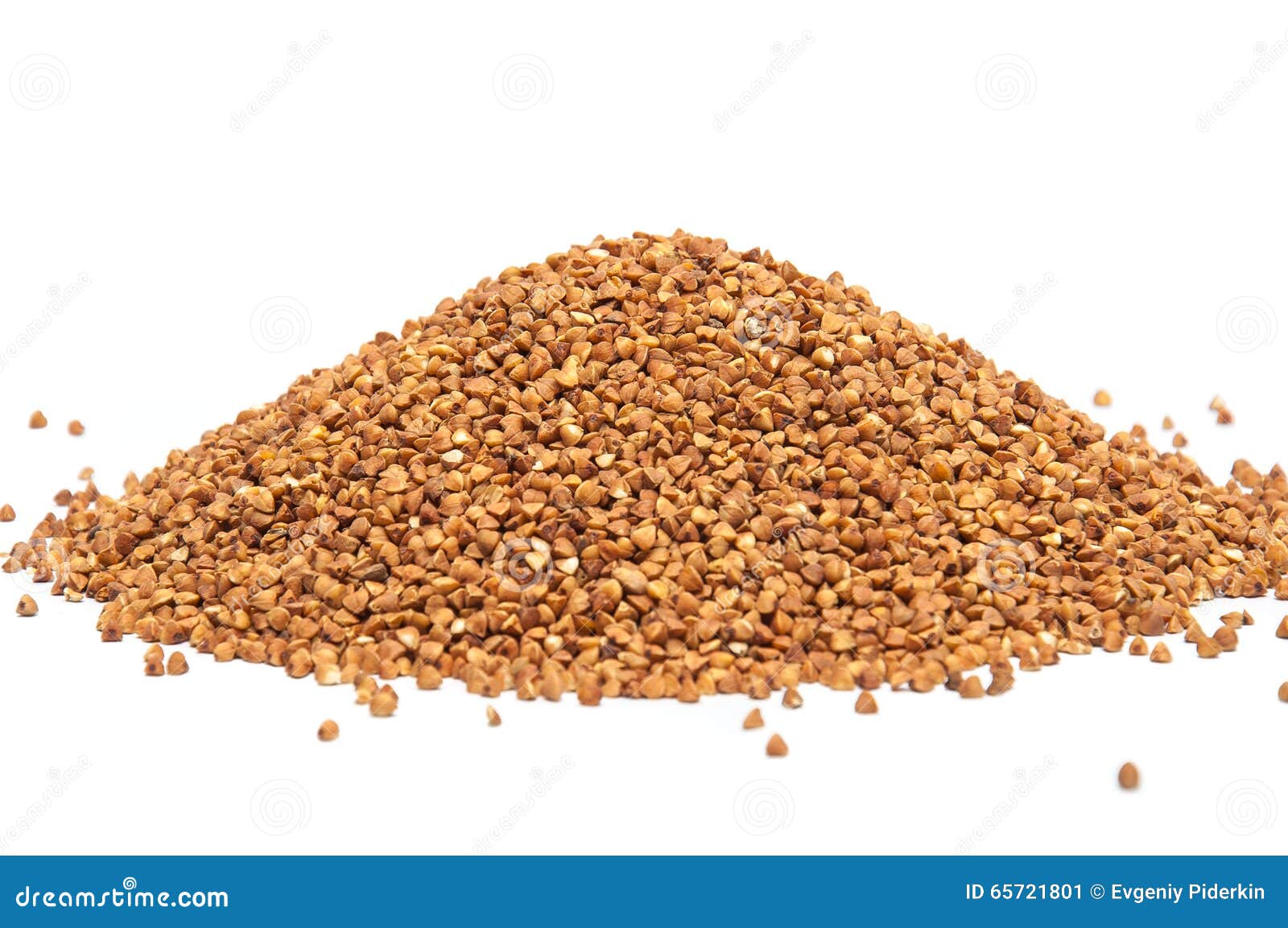 heap of buckweat grains on white background