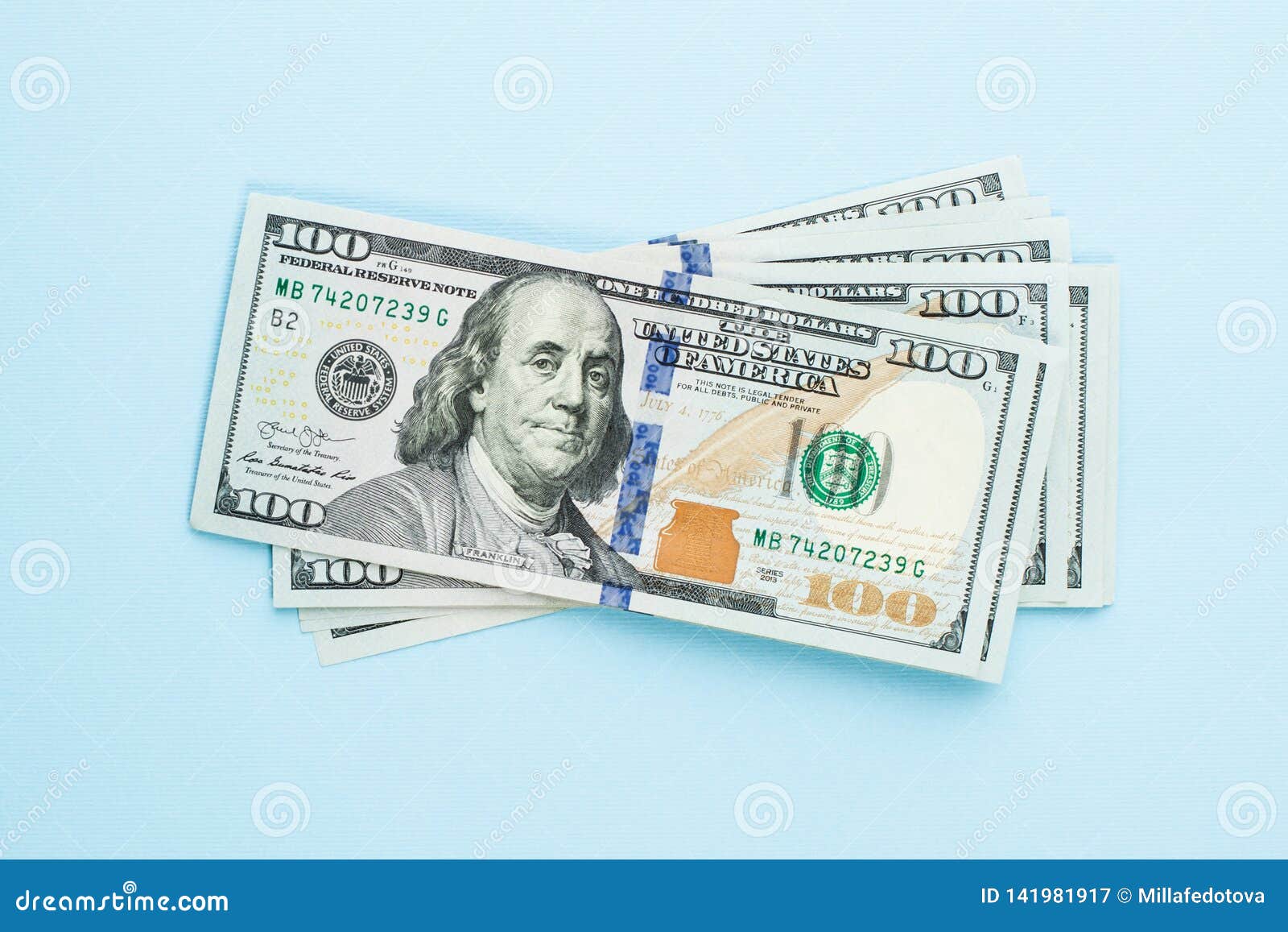 heap of hundred dollars. modern 100 us dollar bills on blue background