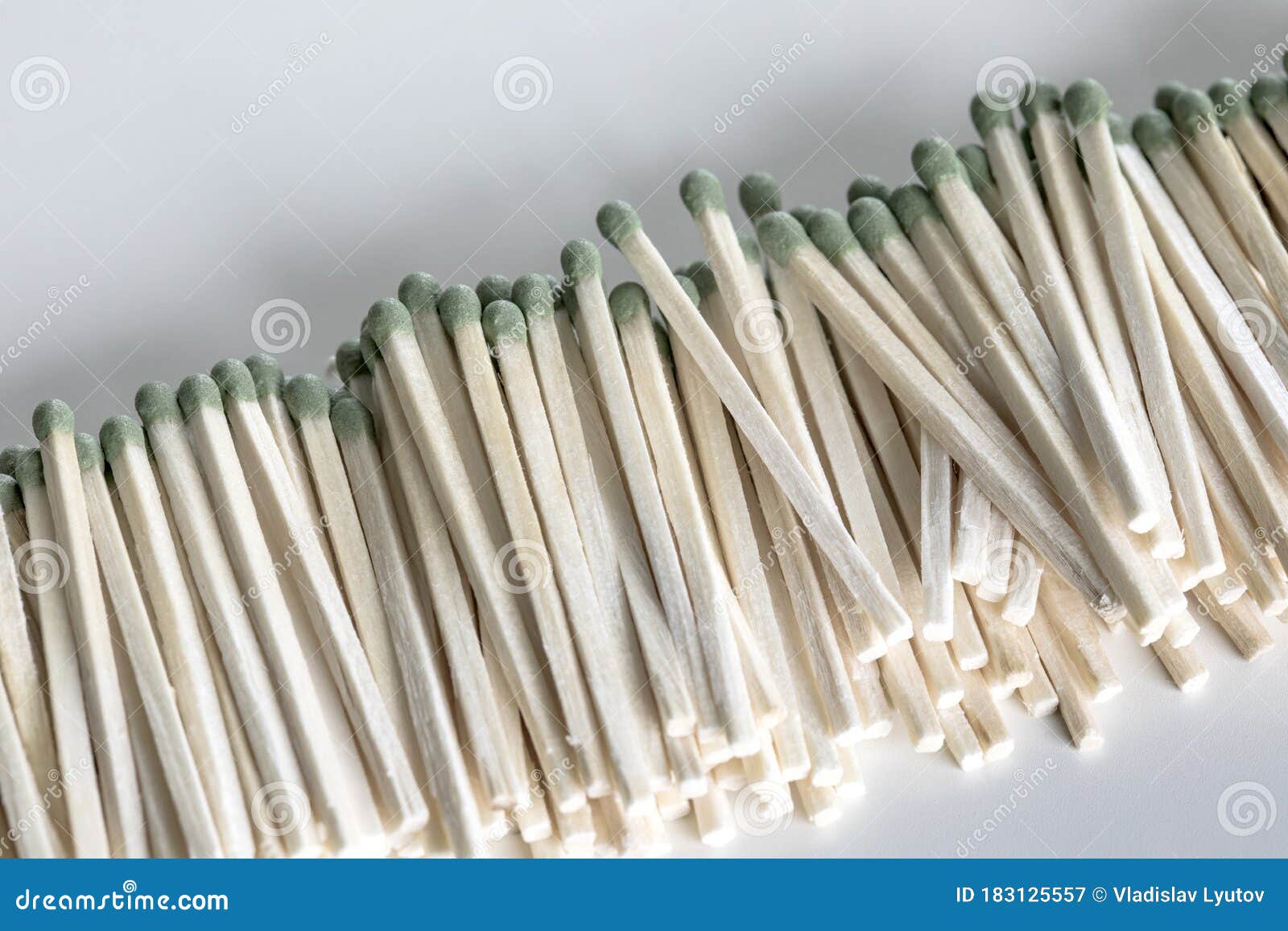 Heap of Matches with Green Heads on a White Background Stock Image