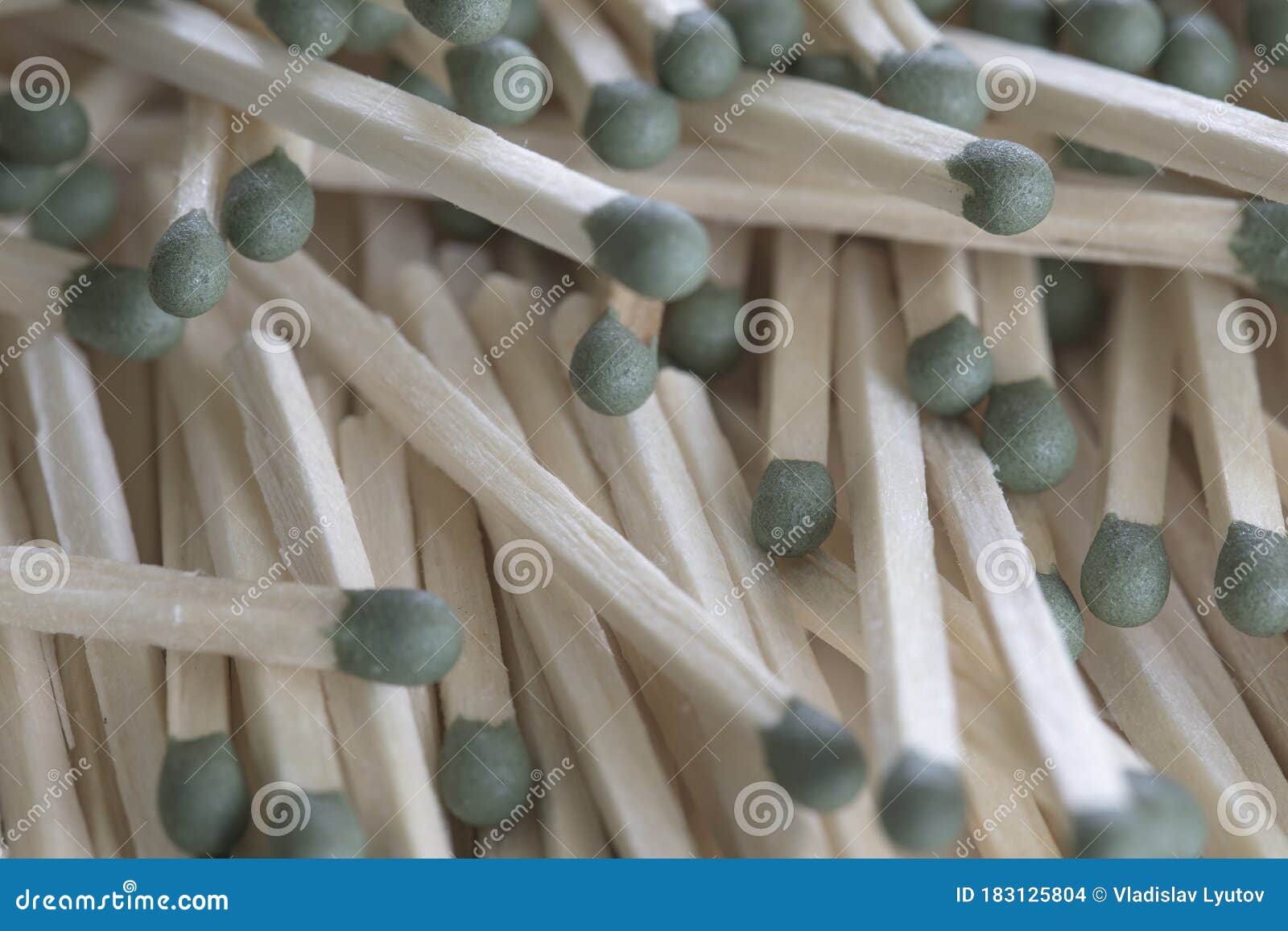Heap of Matches with Green Heads on a White Background Stock Photo