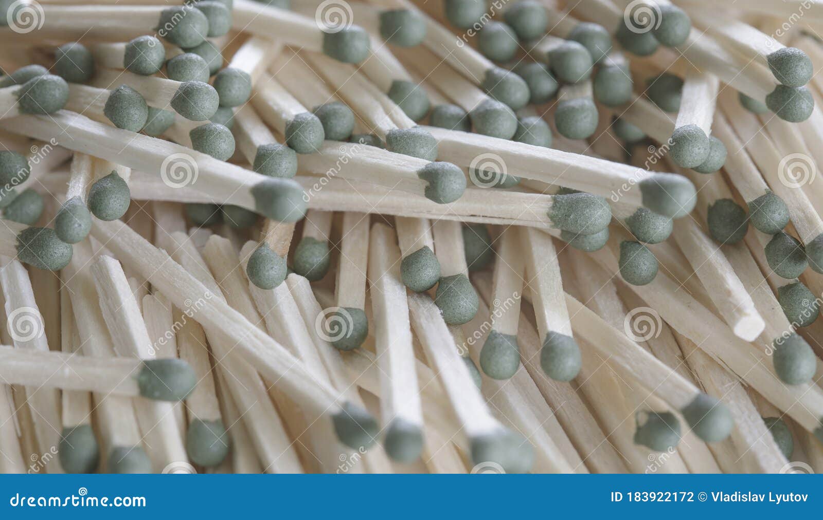 Heap of Matches with Green Heads on a White Background Stock Photo