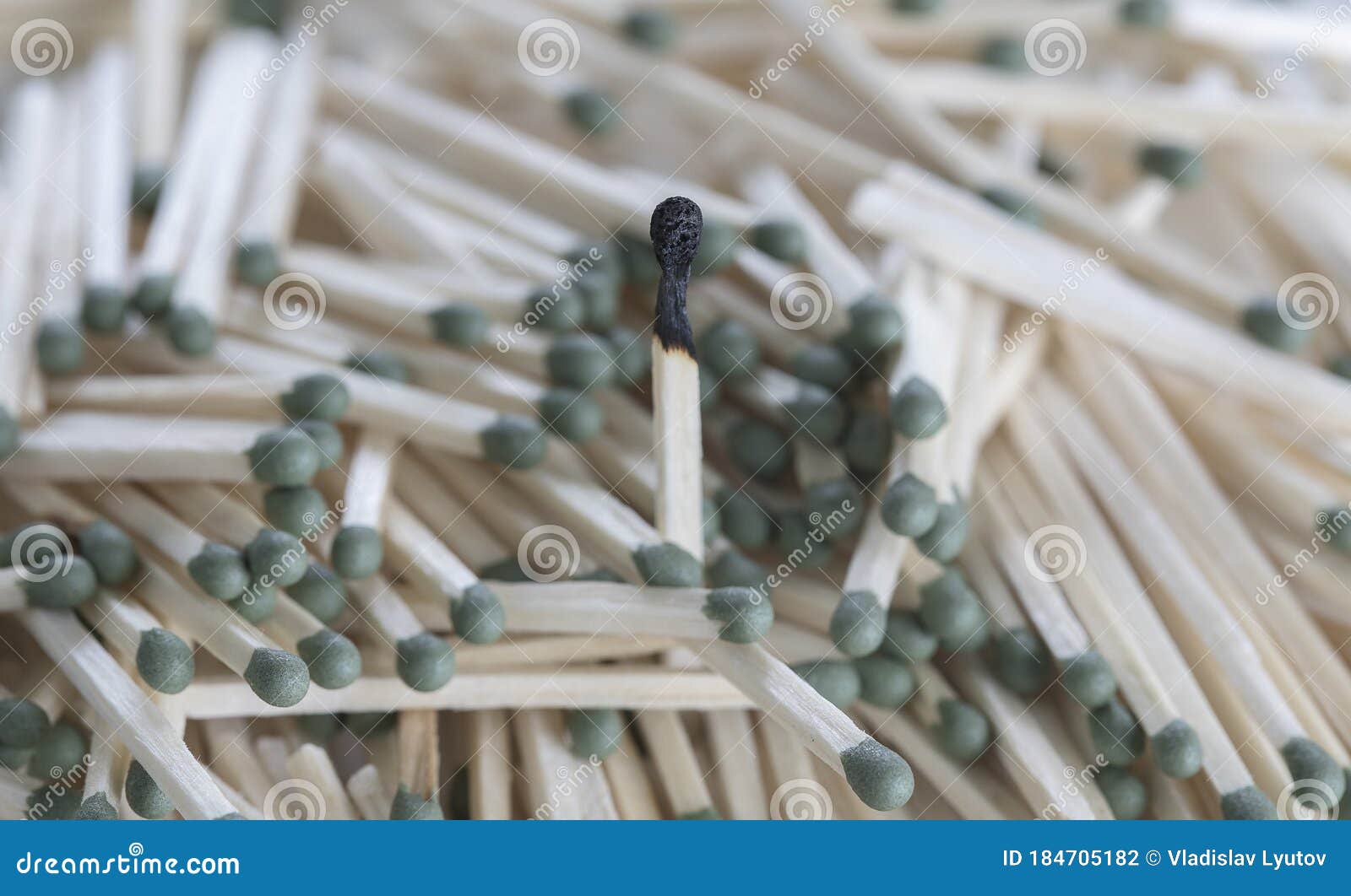 Heap of Matches with Green Heads on a White Background Stock Photo