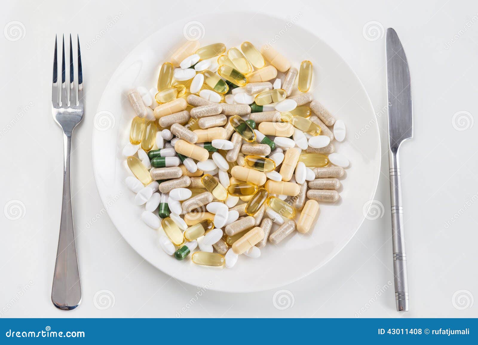 Heap of pills on the dish stock photo. Image of golden - 43011408