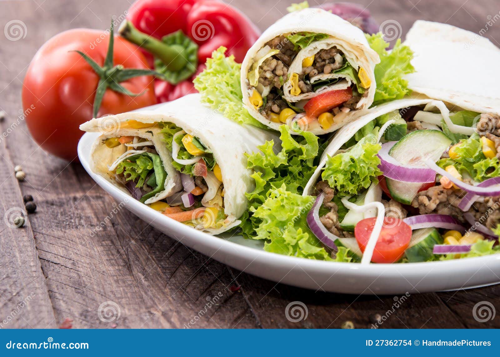 Heap of Wraps on a plate stock photo. Image of tomato 27362754
