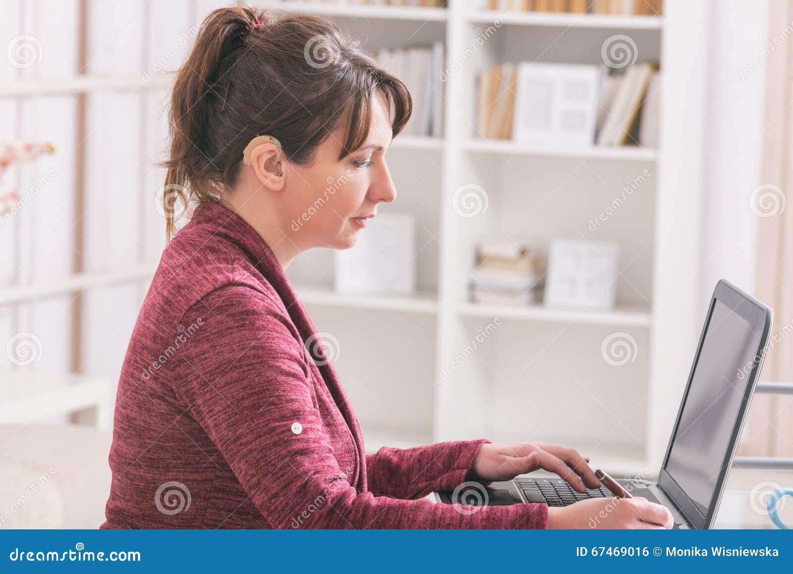 hearing impaired woman working with laptop