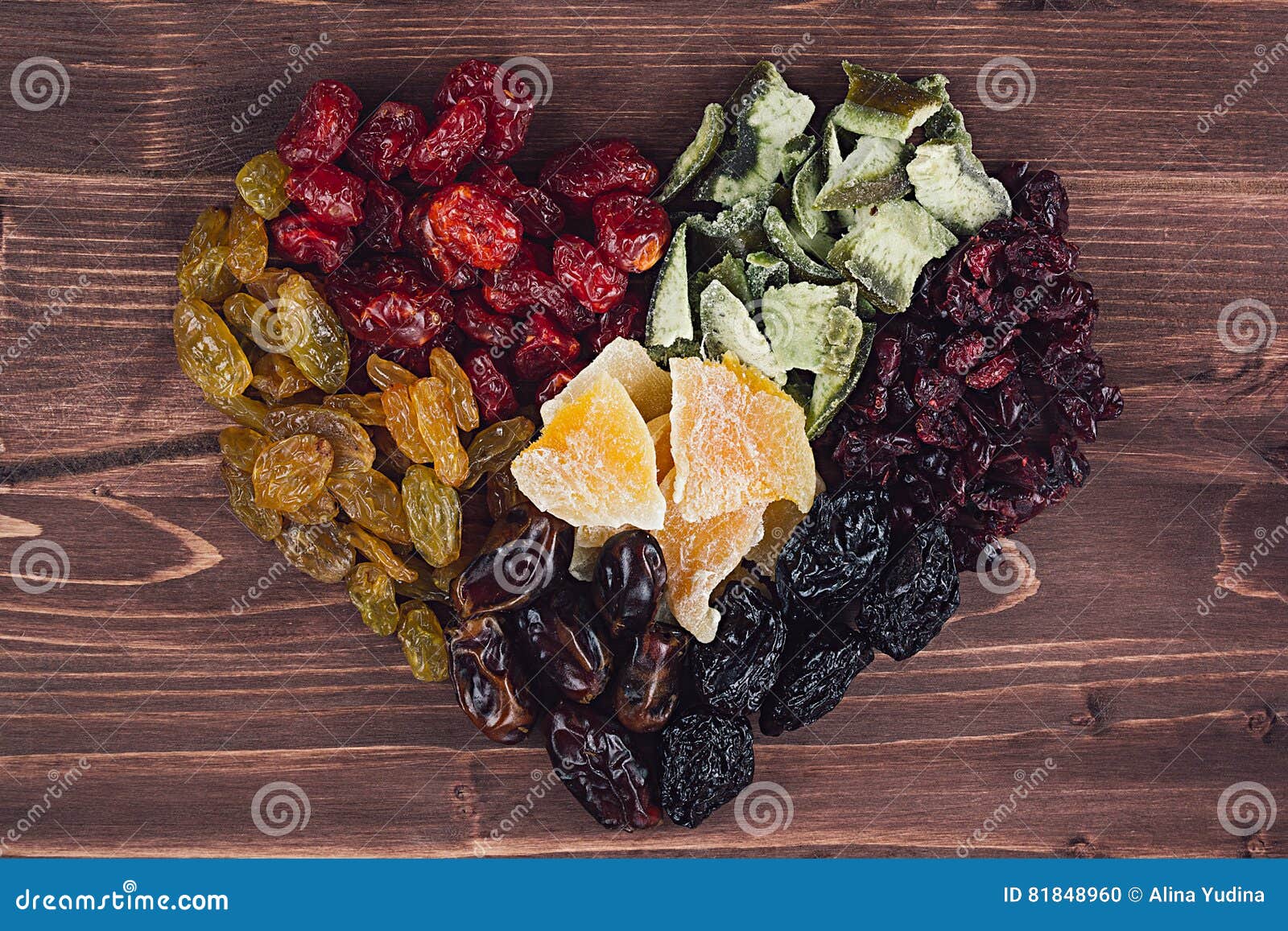 Heart of Dried Fruits Closeup on Brown Wooden Background. Decorative ...