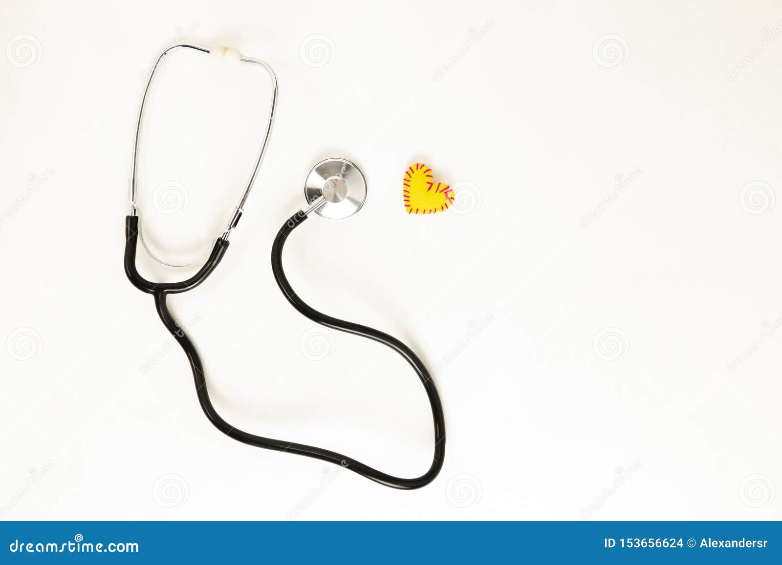 Heart health and prevention concept. Stethoscope and red heart of crochet on white isolated background with space for text.