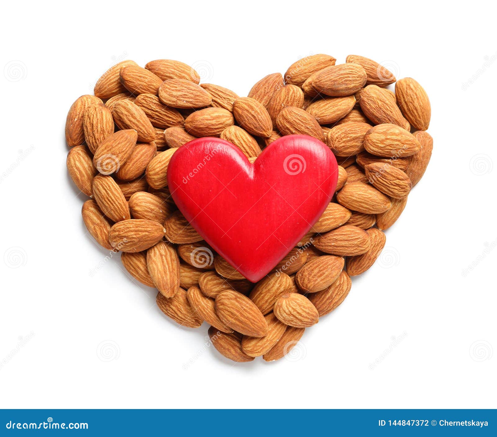 Heart Made of Almonds and Decor on White, Top View. Healthy Diet Stock
