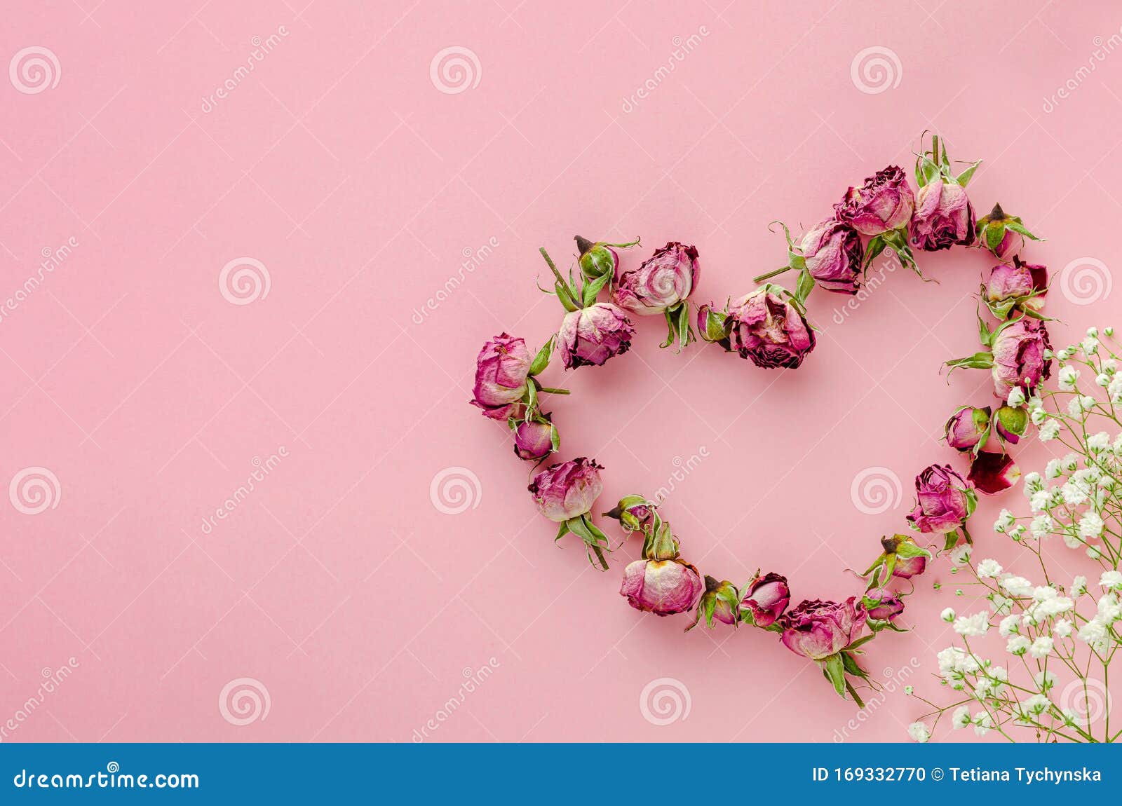 Heart Shape Made with Dried Roses and Decorated with Flowers on Pink ...