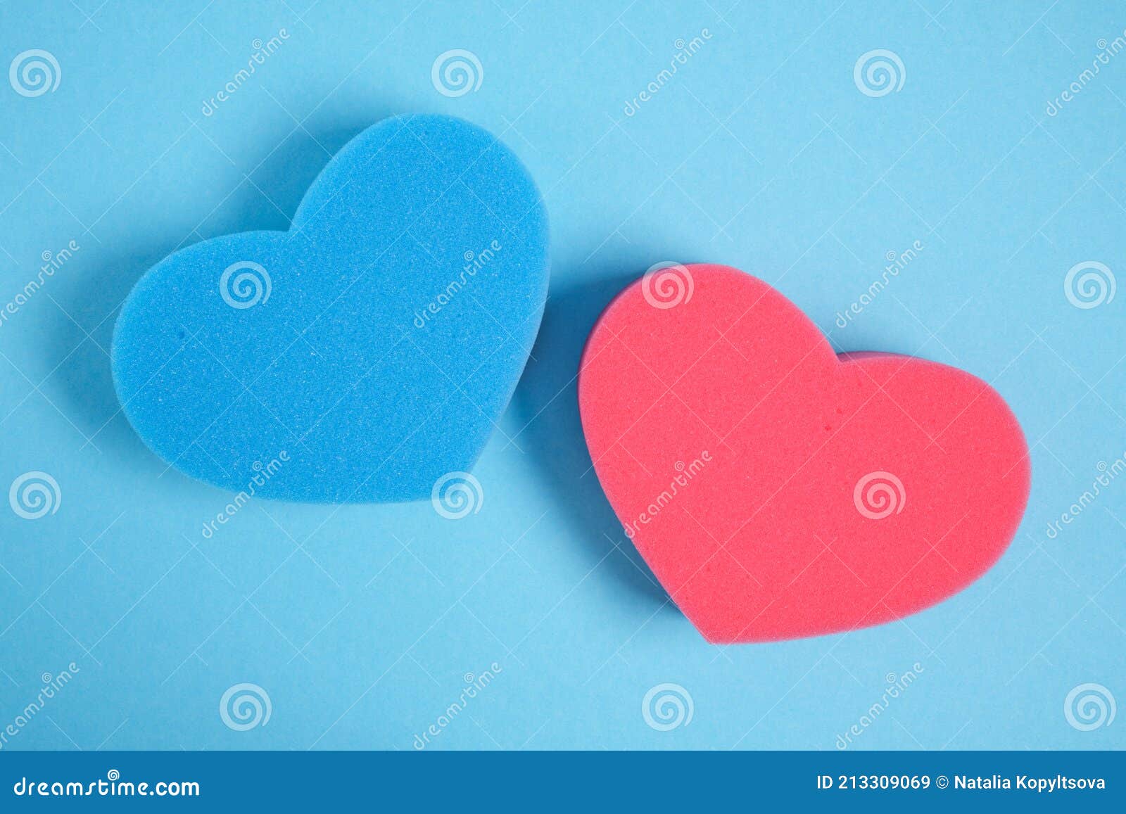 Heart Shape Sponges on Blue Background Copy Space Stock Image Image