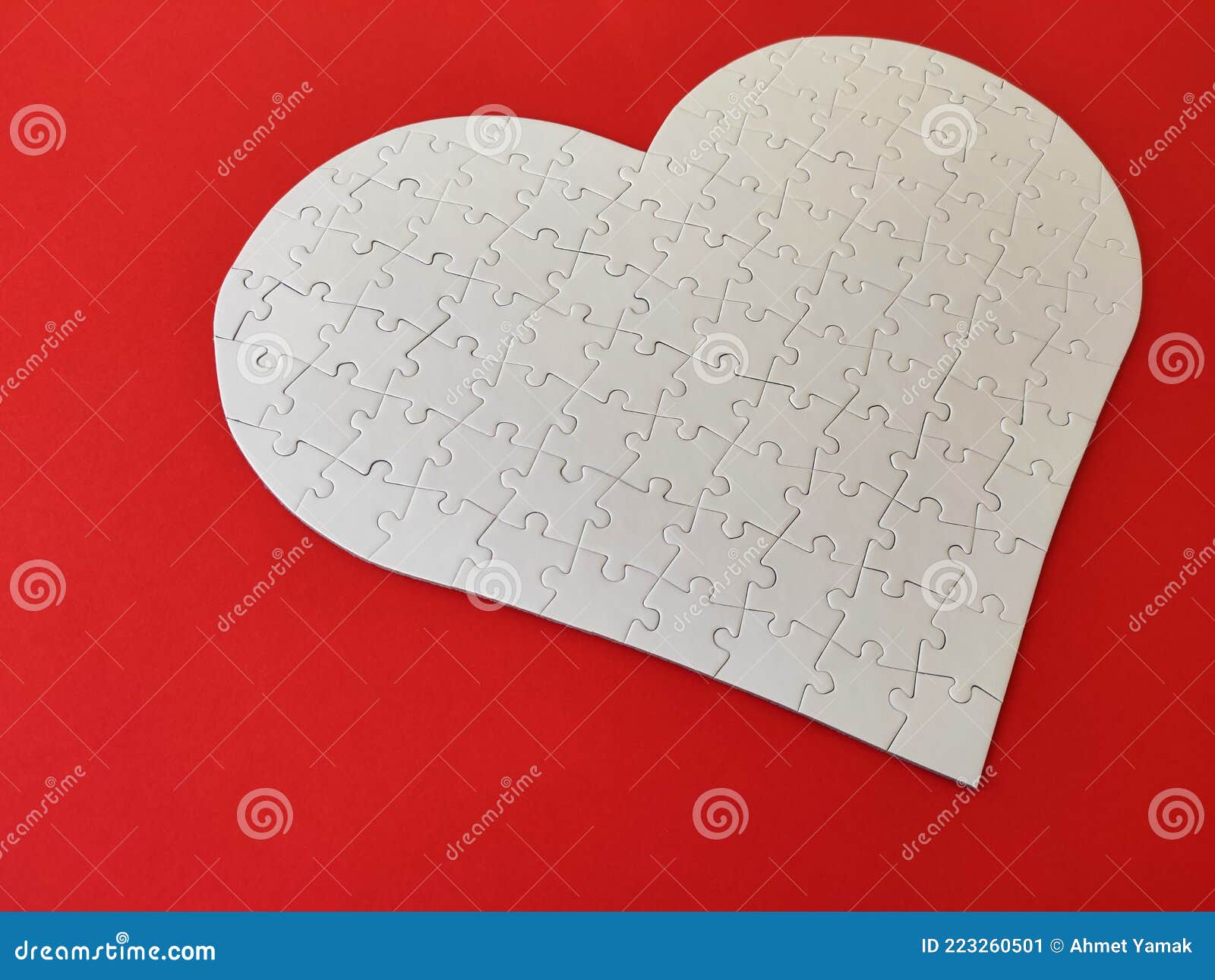 Heart Shaped Blank White Jigsaw Puzzle on Red Background Puzzle Pieces