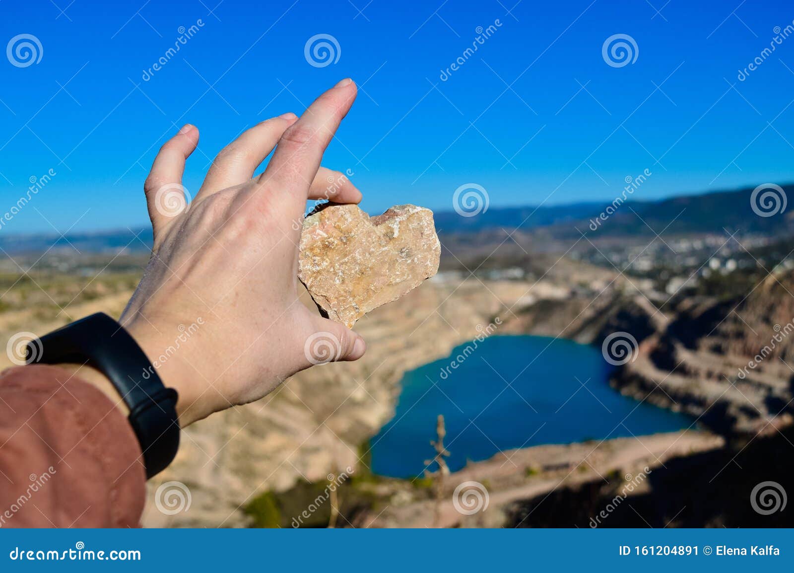 heart d blue quarry lake. a stone in the  of a heart. kadykovsky quarry, balaklava, crimea. travel