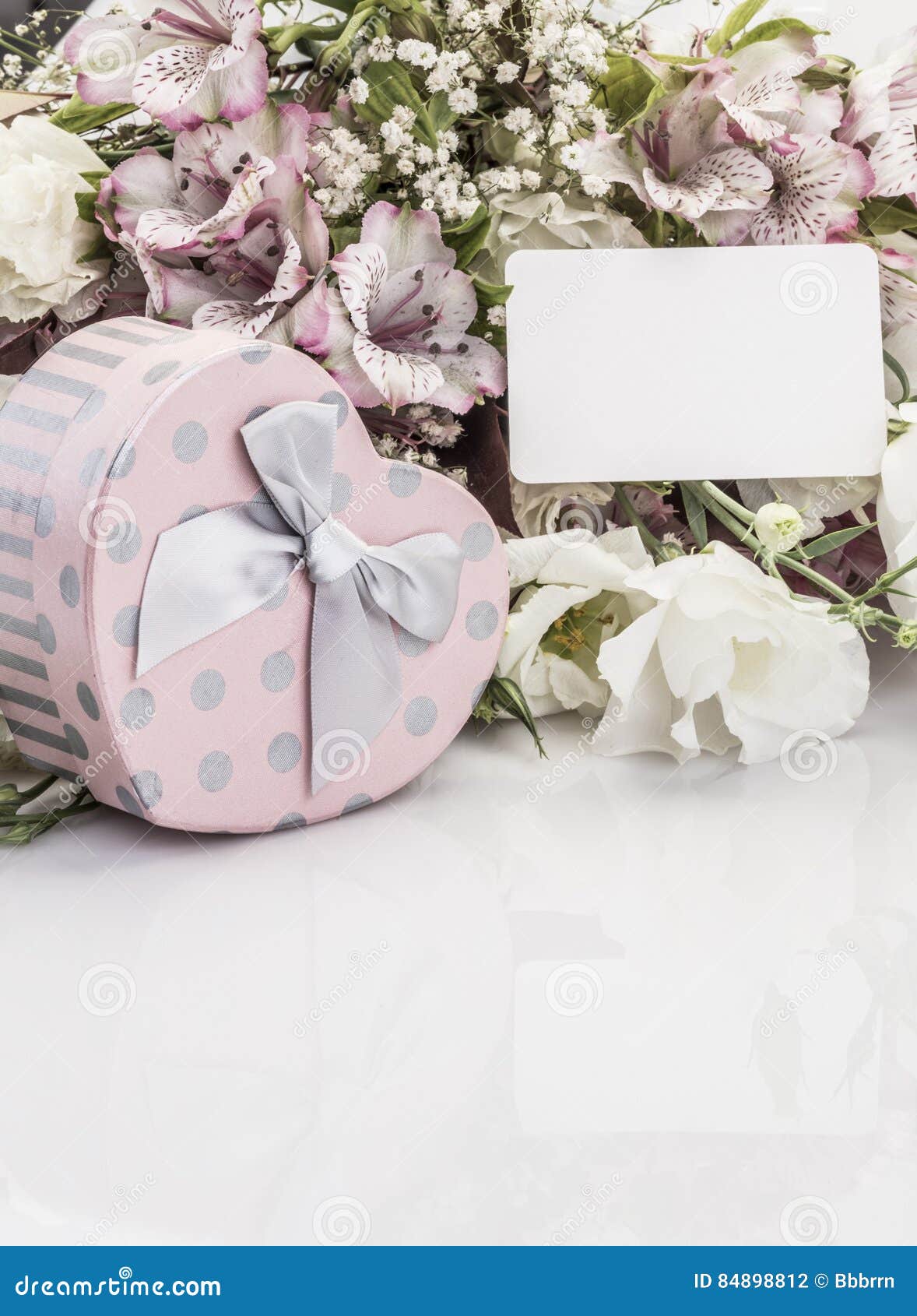Heart Shaped Gift Box and Flowers with a Name Tag Stock Photo Image